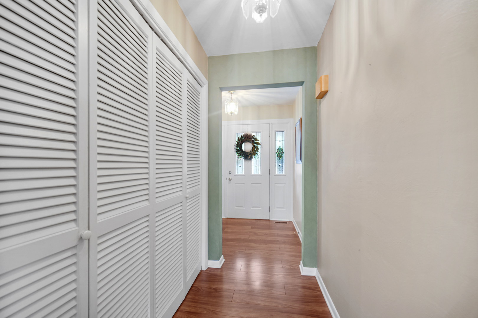 2296 185th Place Lansing, IL 60438 - Photo 5 of 32 a view of a hallway with wooden floor