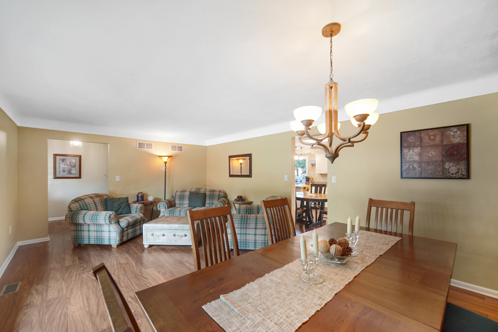 2296 185th Place Lansing, IL 60438 - Photo 10 of 32 a view of a livingroom with furniture window and wooden floor