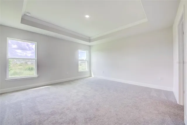 a view of an empty room and a window