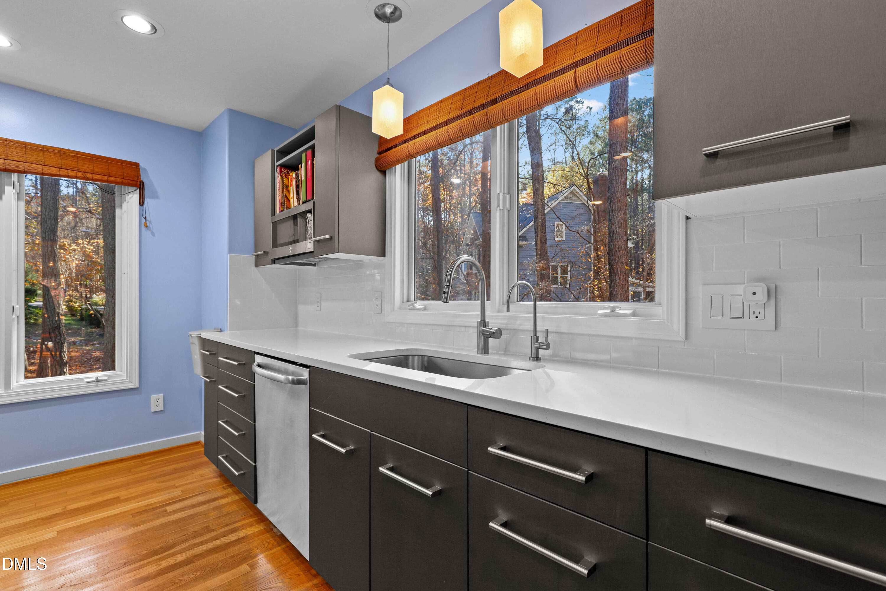 2617 Scarlet Sage Court Raleigh, NC 27613 - Photo 10 of 78 a kitchen with a sink stove and cabinets