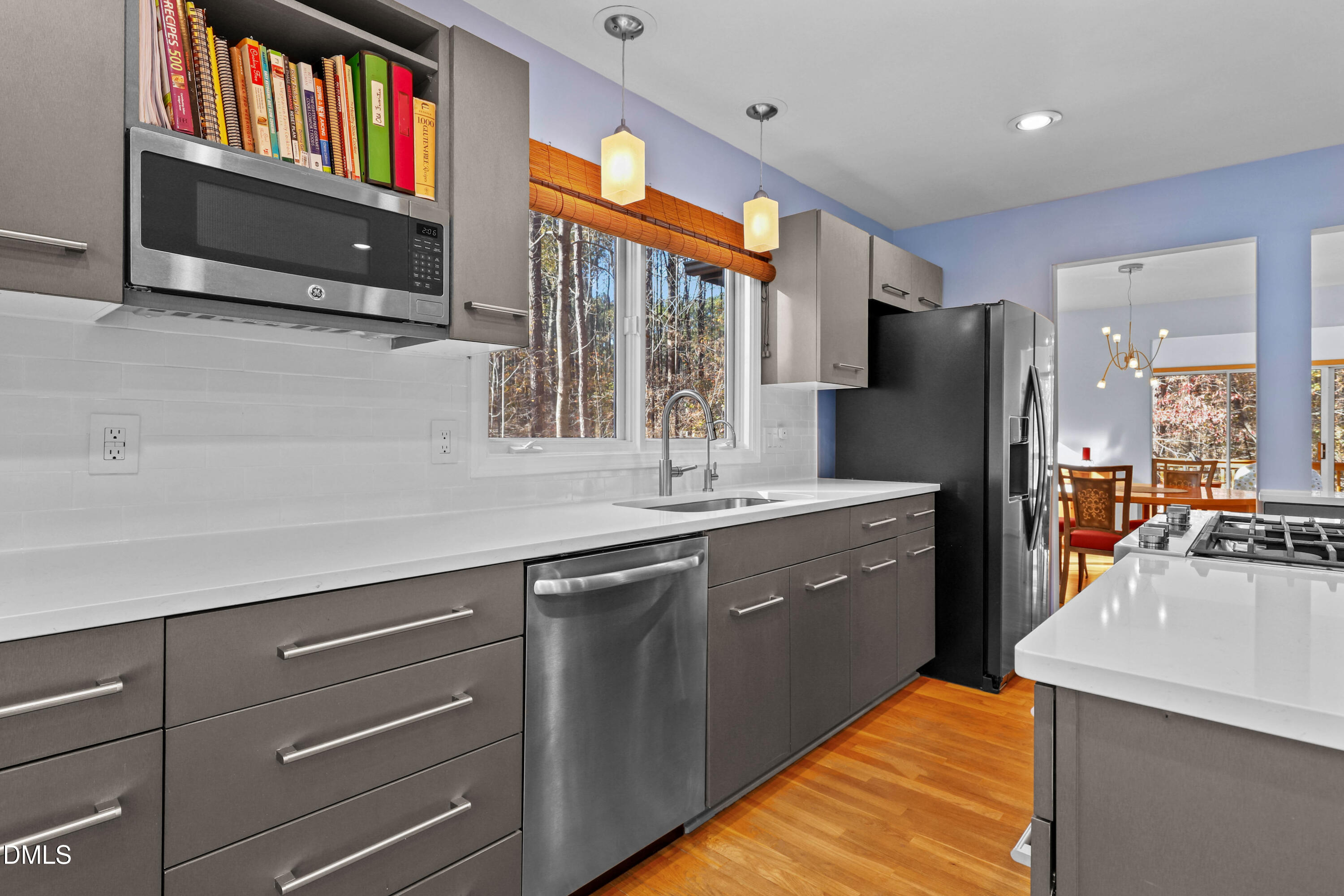 2617 Scarlet Sage Court Raleigh, NC 27613 - Photo 11 of 78 a large kitchen with stainless steel appliances granite countertop a refrigerator a oven a sink and dishwasher