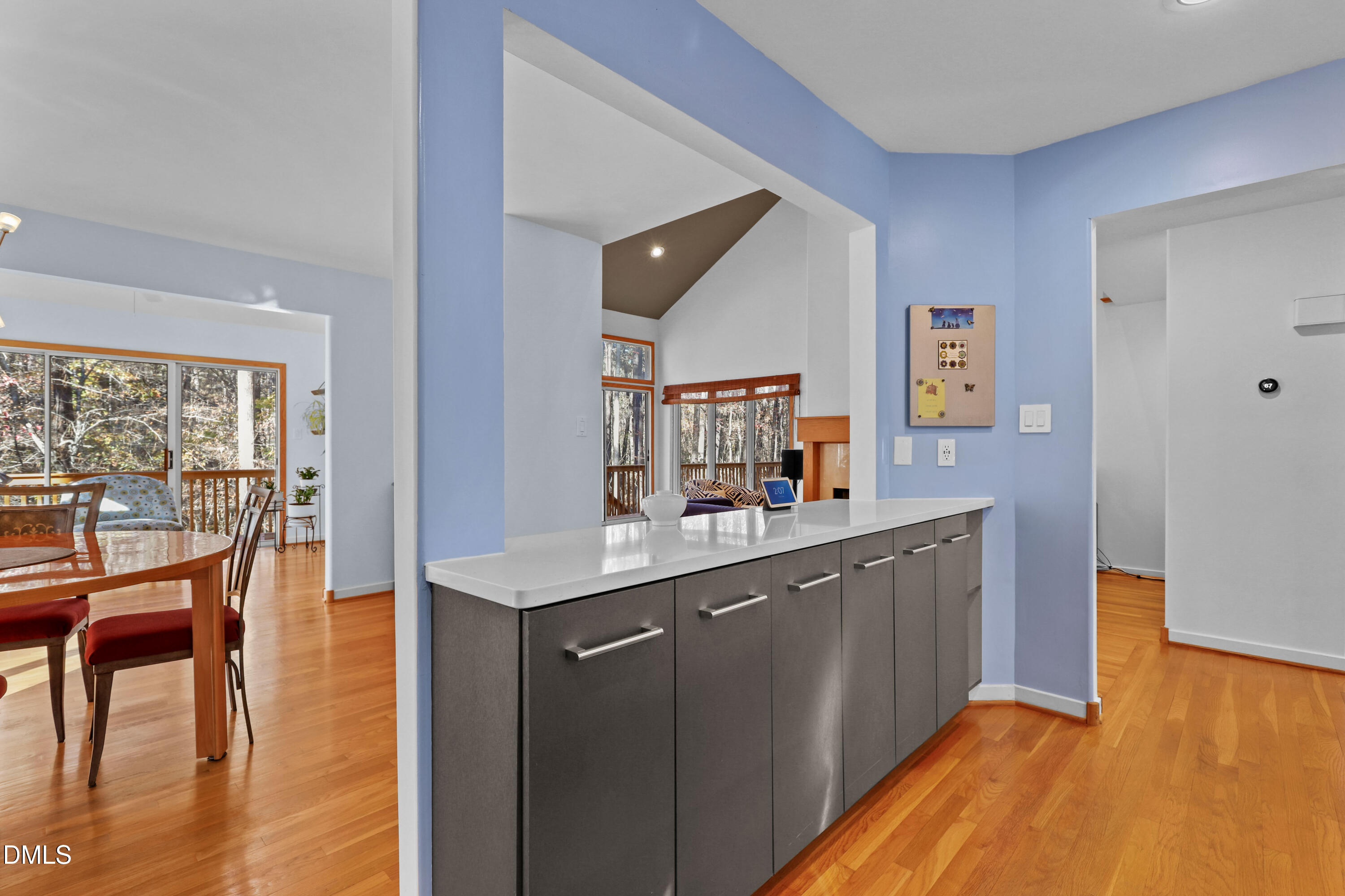 2617 Scarlet Sage Court Raleigh, NC 27613 - Photo 16 of 78 a kitchen with a wooden floor and a view of living room