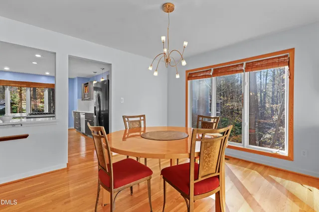 a bedroom with a bed and large window