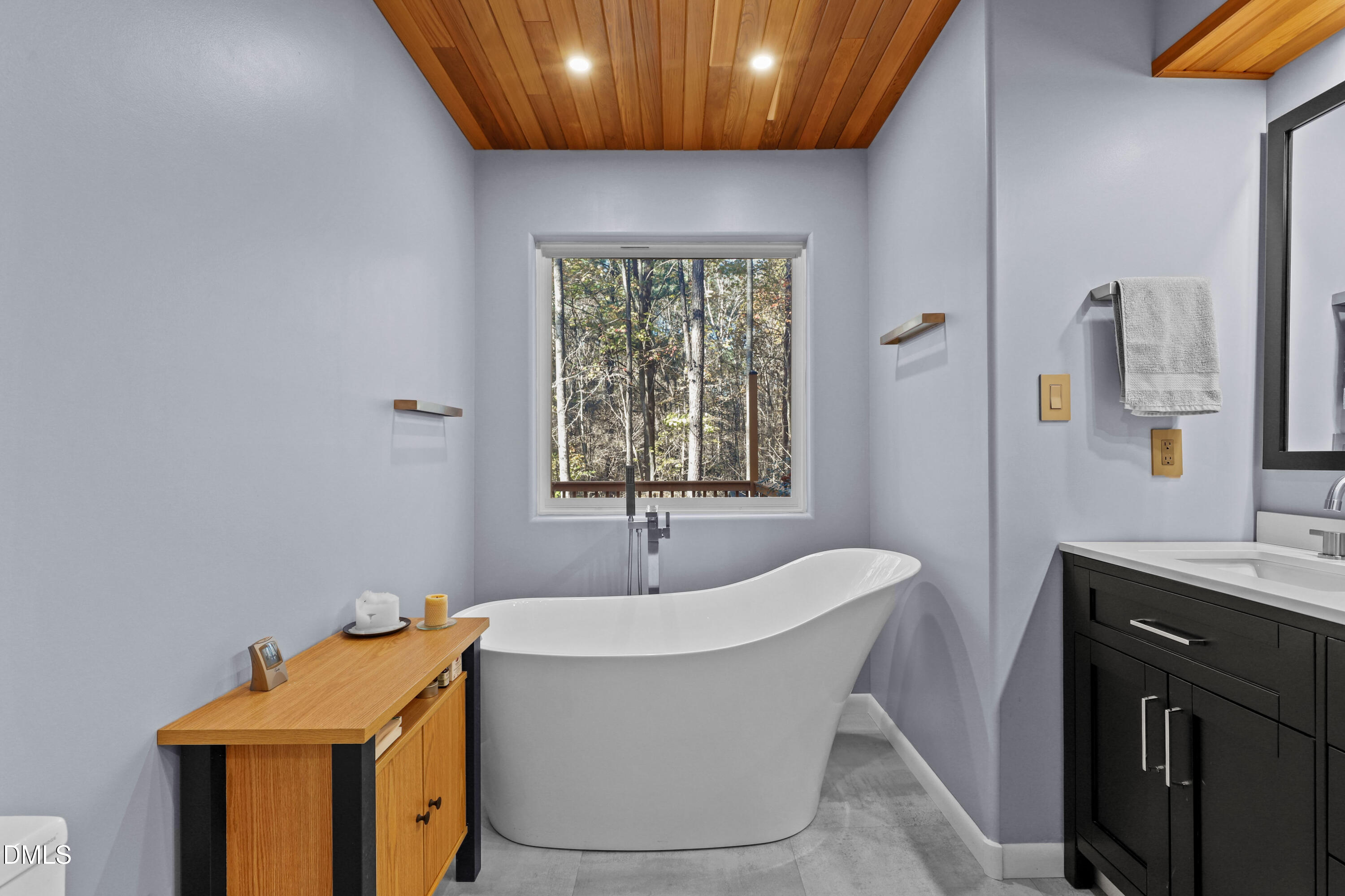 2617 Scarlet Sage Court Raleigh, NC 27613 - Photo 27 of 78 a bathroom with a bathtub and a window