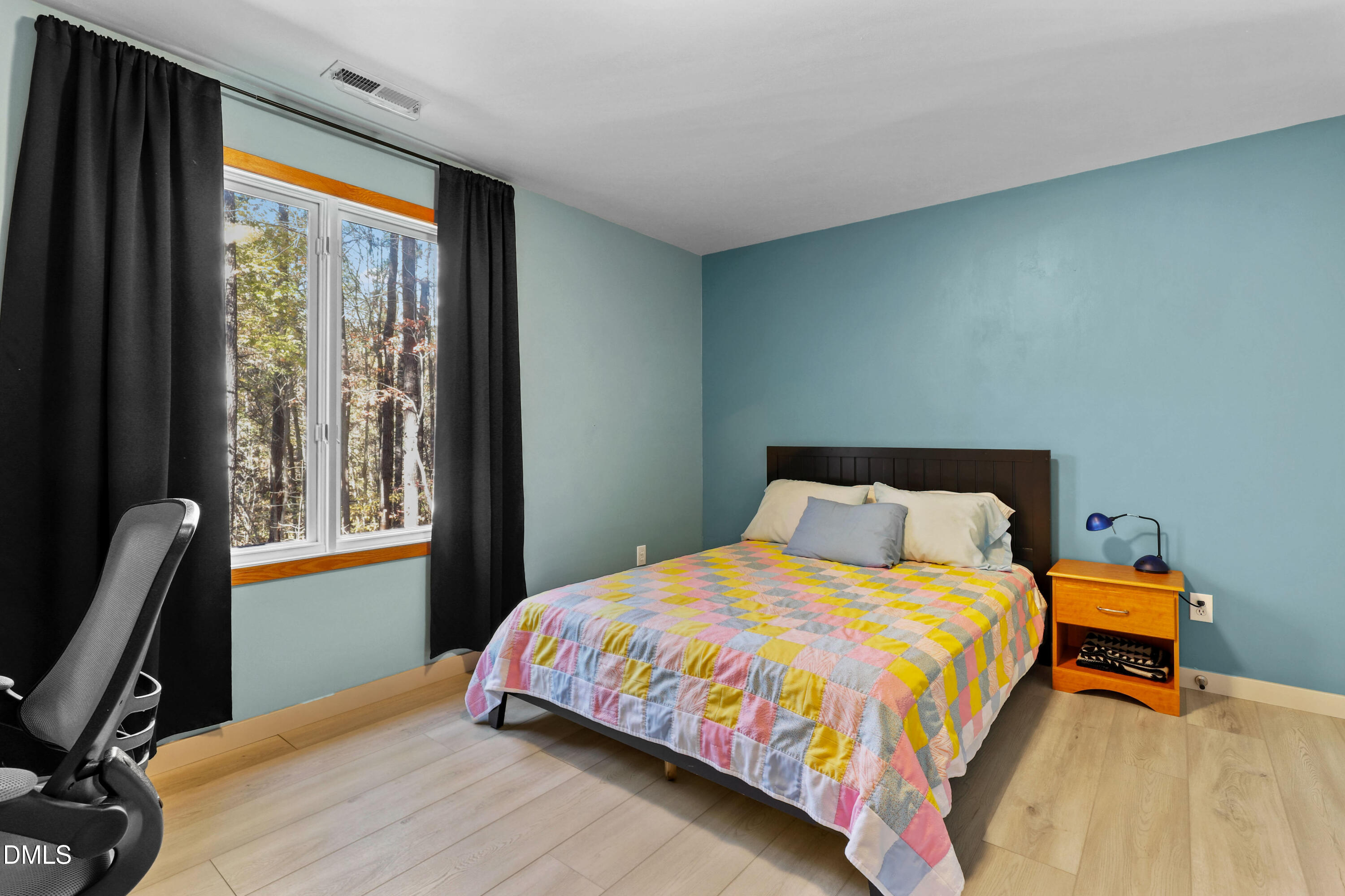 2617 Scarlet Sage Court Raleigh, NC 27613 - Photo 31 of 78 a bedroom with a bed and a window