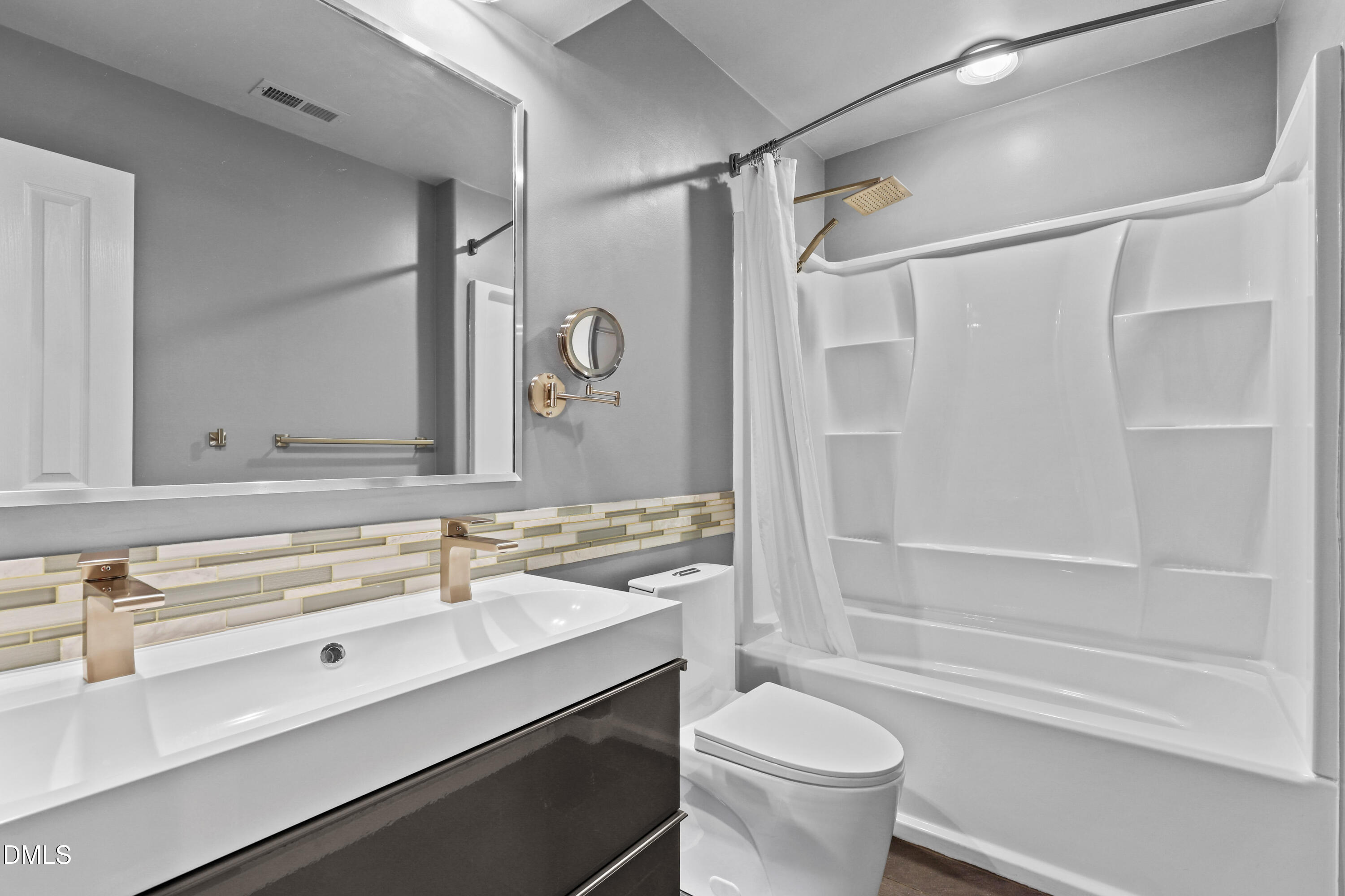 2617 Scarlet Sage Court Raleigh, NC 27613 - Photo 33 of 78 a bathroom with a sink a toilet and a bathtub