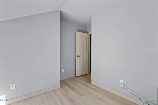 a view of workspace with wooden floor windows