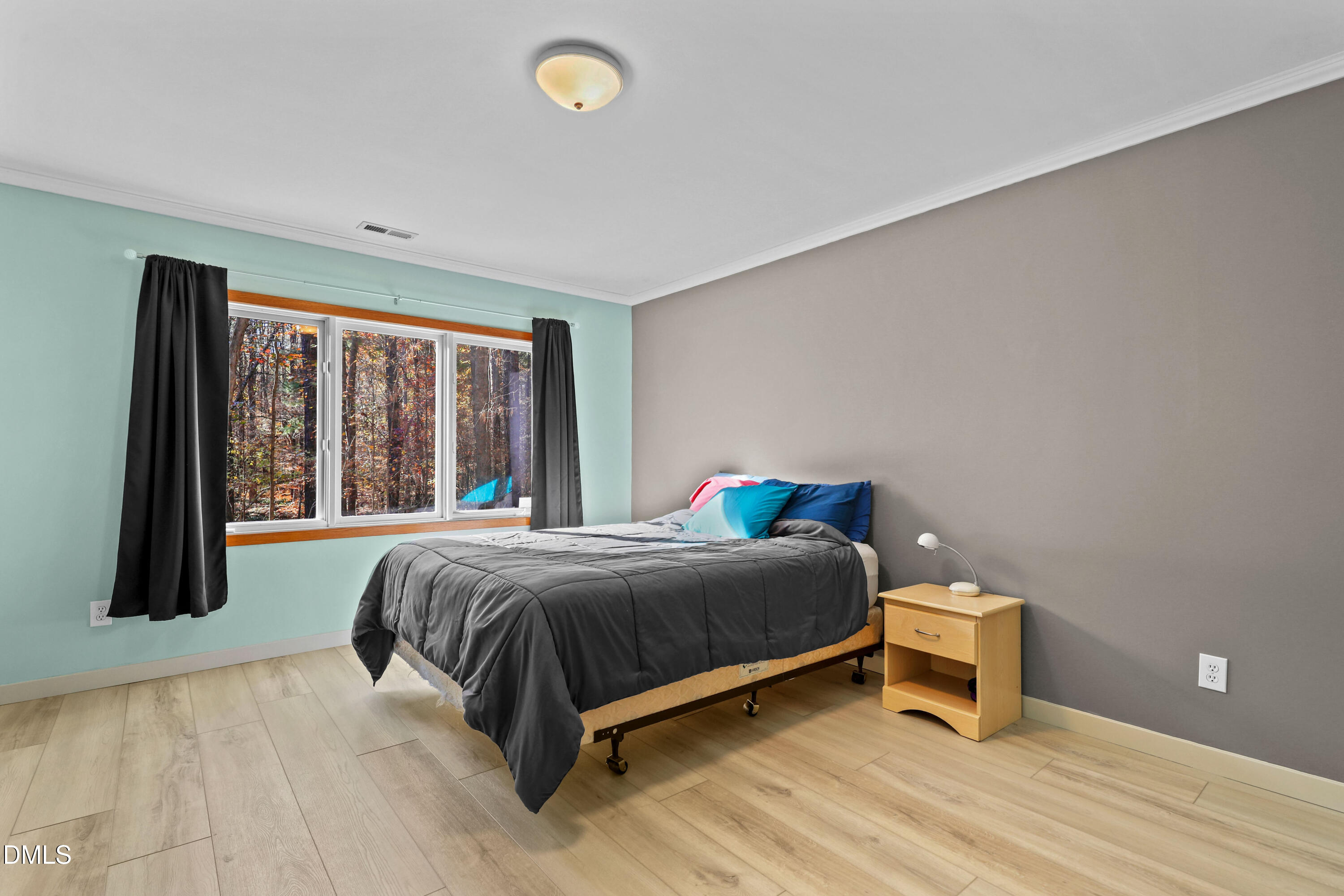 2617 Scarlet Sage Court Raleigh, NC 27613 - Photo 44 of 78 a bed sitting in a bedroom next to a window