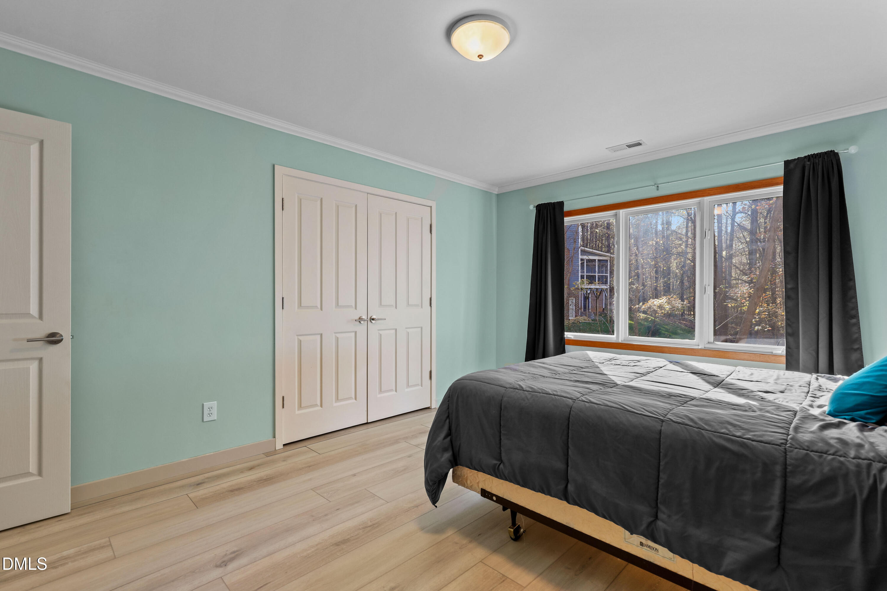 2617 Scarlet Sage Court Raleigh, NC 27613 - Photo 45 of 78 a bedroom with a bed and a window