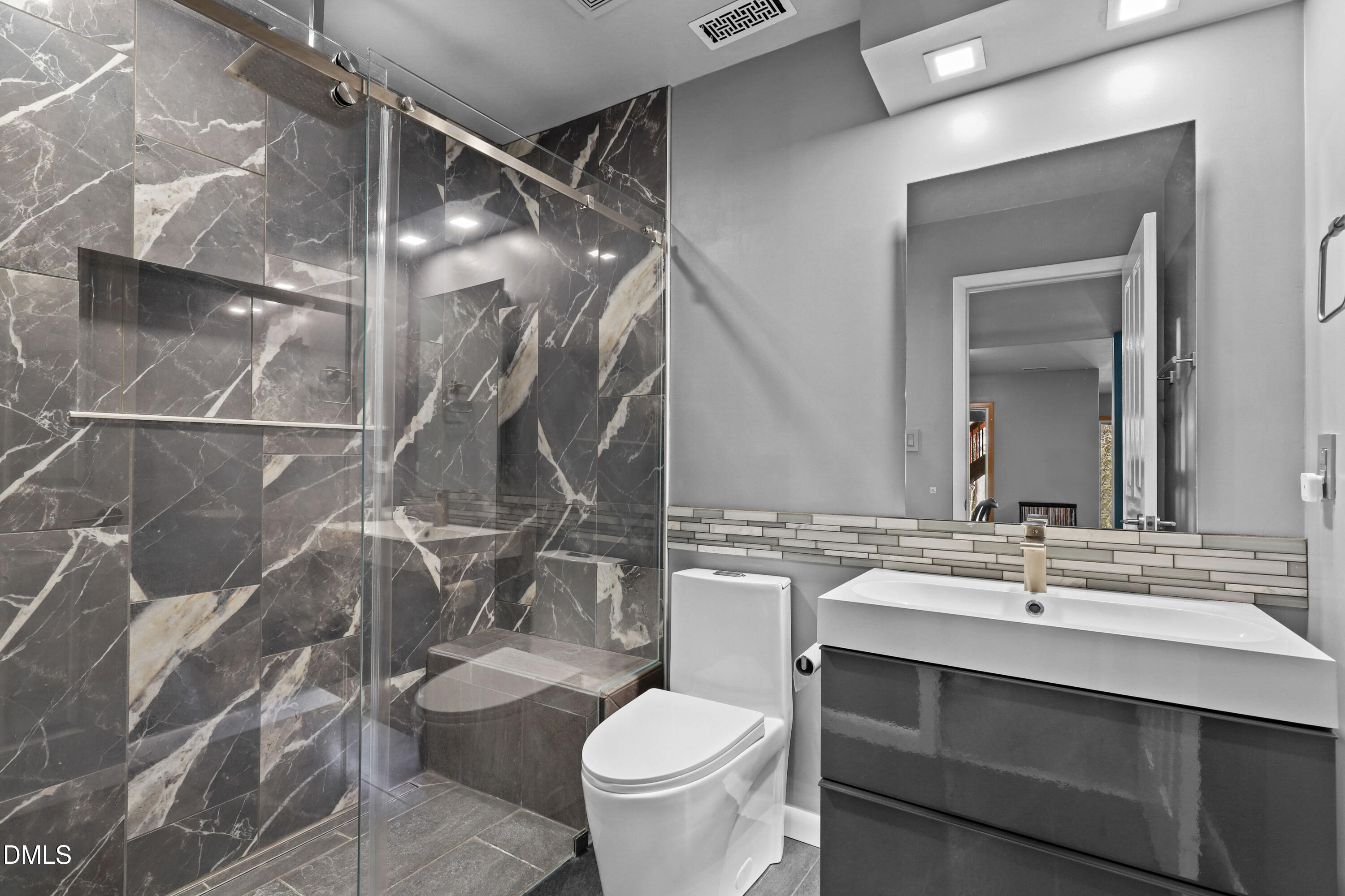 2617 Scarlet Sage Court Raleigh, NC 27613 - Photo 46 of 78 a bathroom with a sink toilet and shower