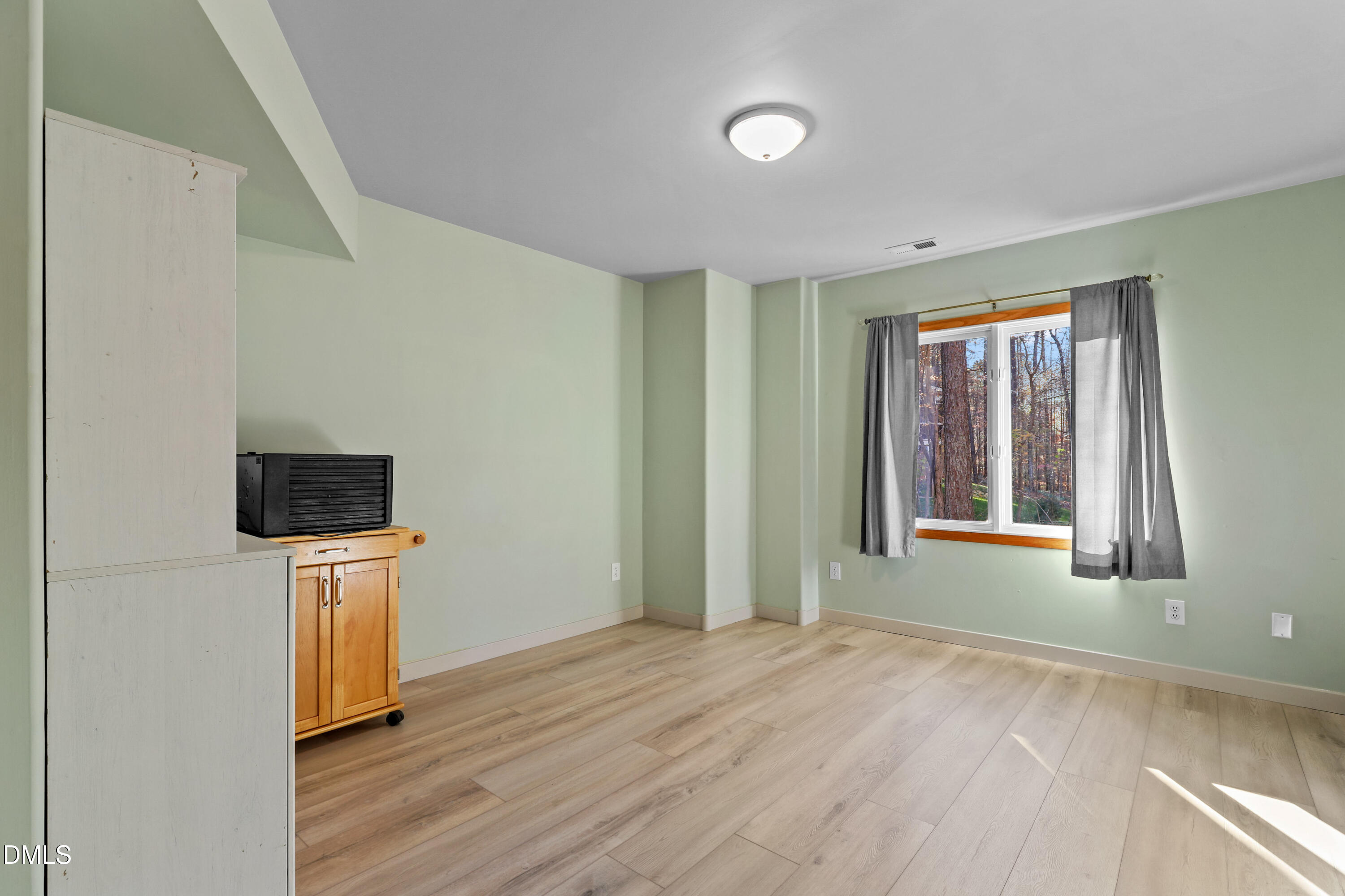 2617 Scarlet Sage Court Raleigh, NC 27613 - Photo 47 of 78 a view of a livingroom with wooden floor and a ceiling fan