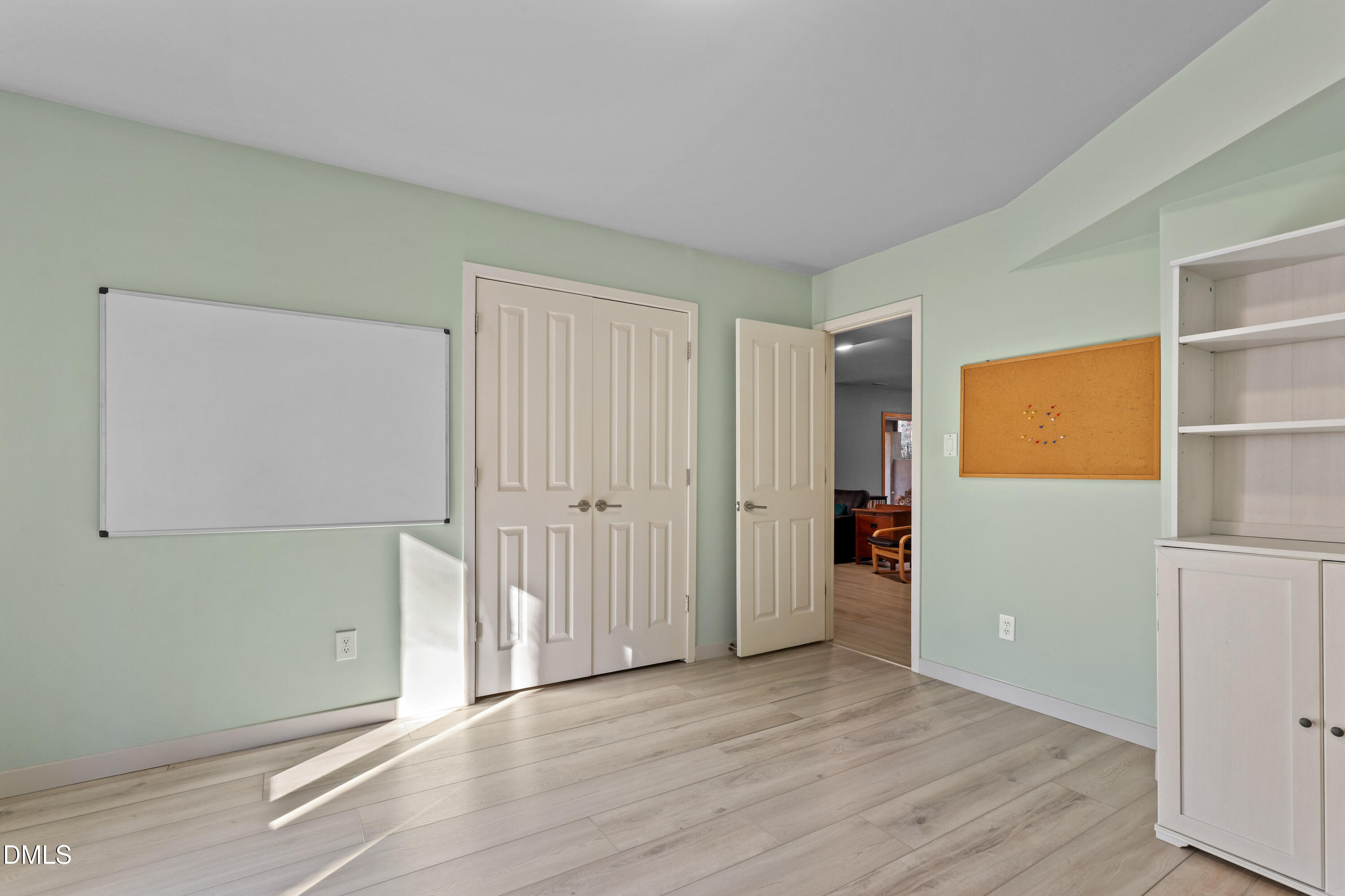 2617 Scarlet Sage Court Raleigh, NC 27613 - Photo 48 of 78 an empty room with wooden floor and closet