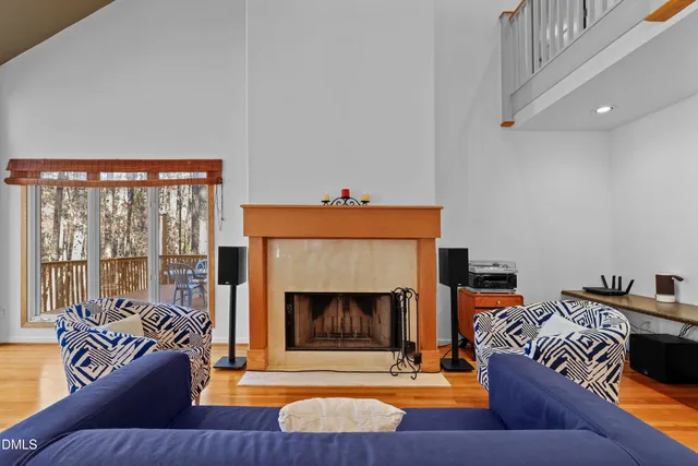 a living room with furniture and floor to ceiling windows