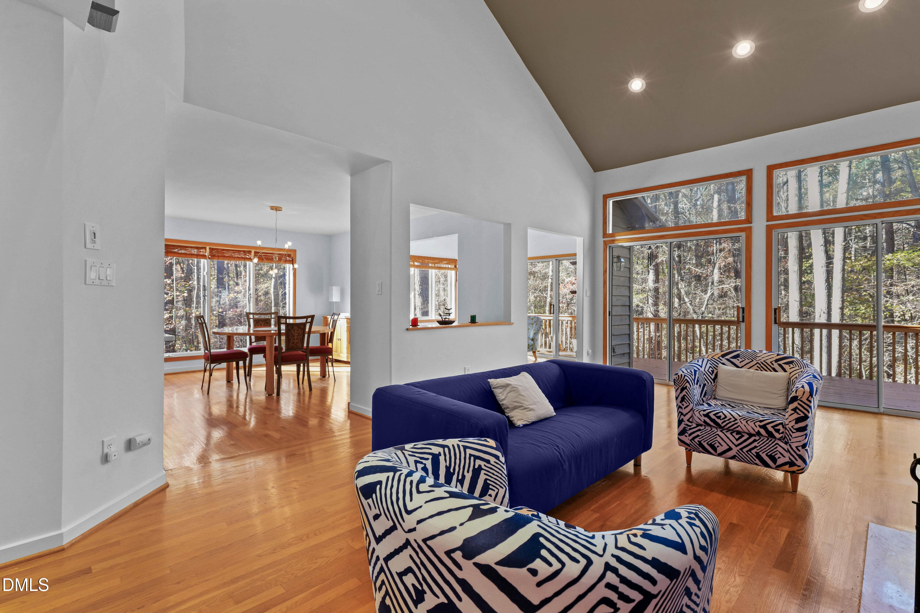 2617 Scarlet Sage Court Raleigh, NC 27613 - Photo 5 of 78 a living room with furniture and floor to ceiling windows