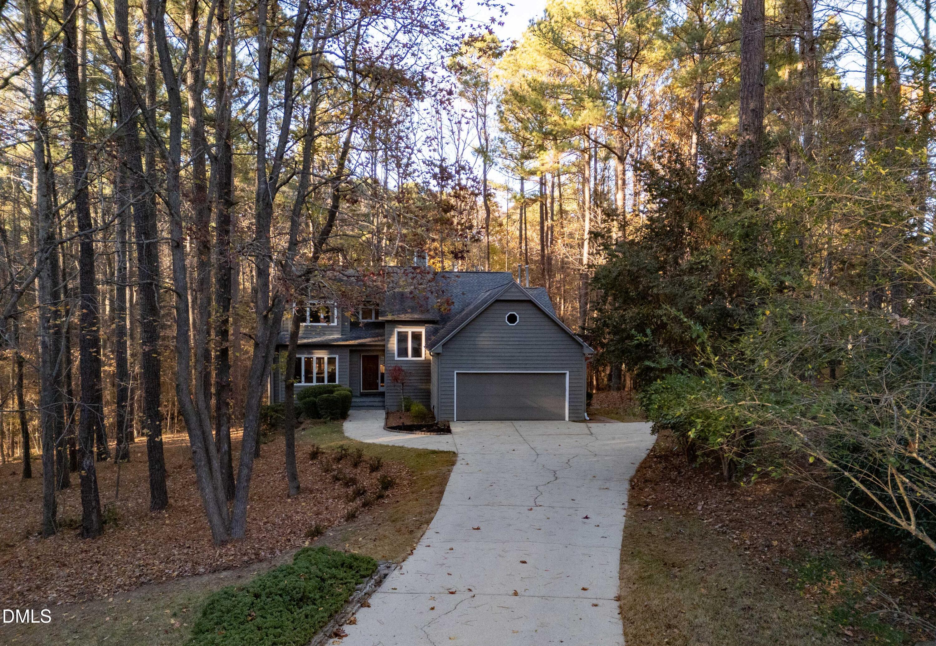 2617 Scarlet Sage Court Raleigh, NC 27613 - Photo 69 of 78 a front view of a house with a yard and large trees