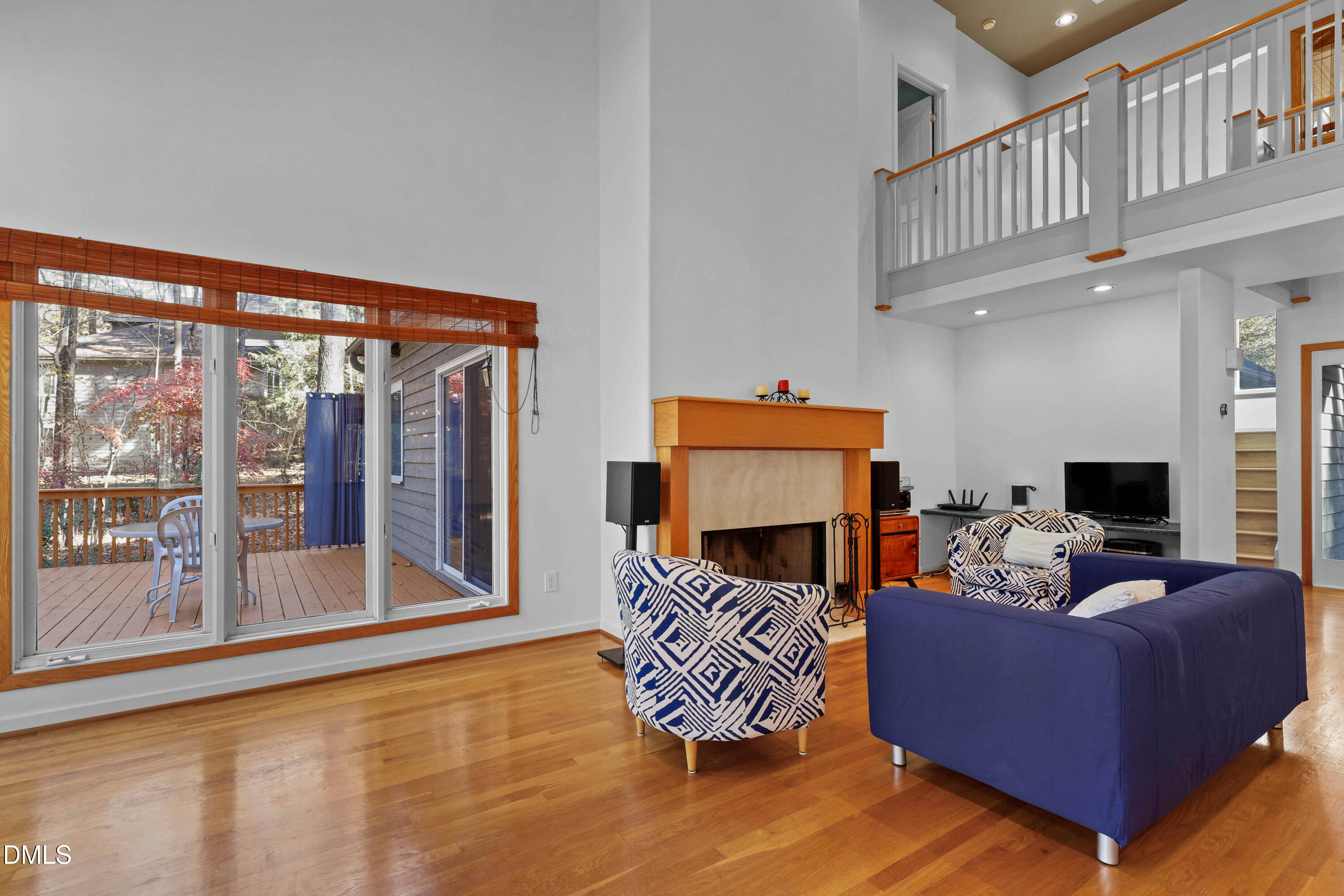 2617 Scarlet Sage Court Raleigh, NC 27613 - Photo 7 of 78 a balcony with furniture and a fireplace