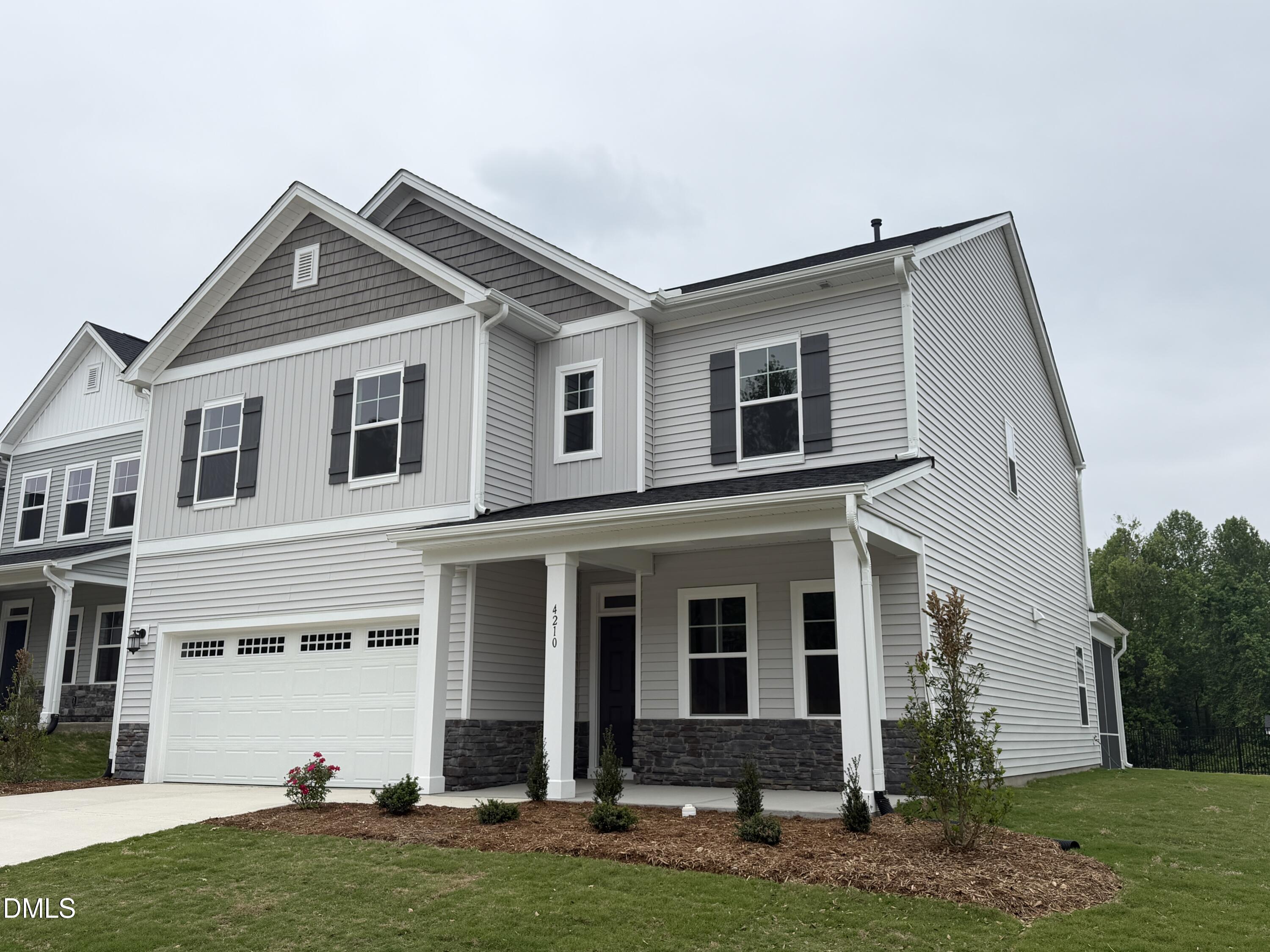 4210 Gray Alder Lane Raleigh, NC 27616 - Photo 1 of 31 a front view of a house with a yard