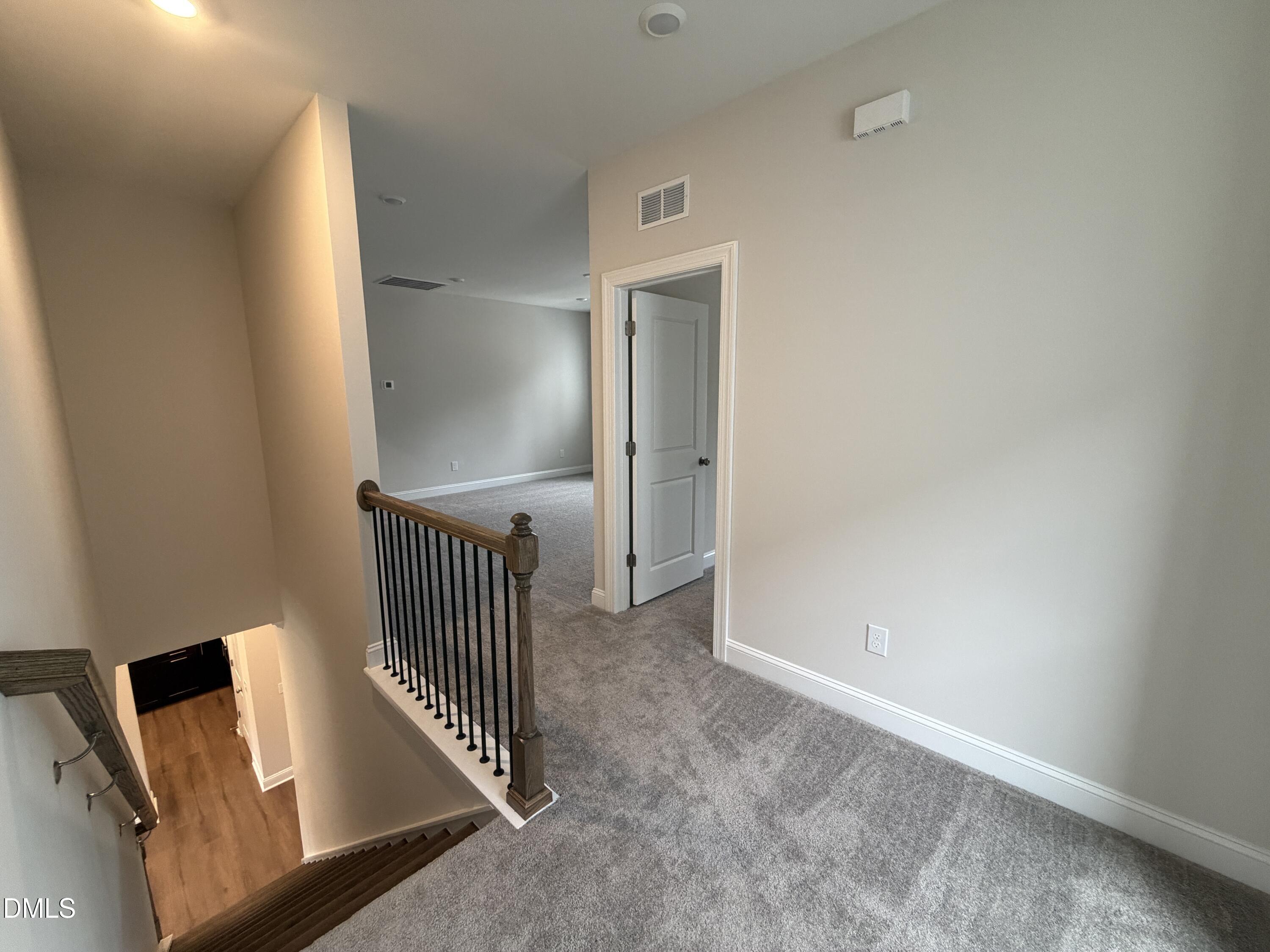 4210 Gray Alder Lane Raleigh, NC 27616 - Photo 12 of 31 a view of a hallway with staircase