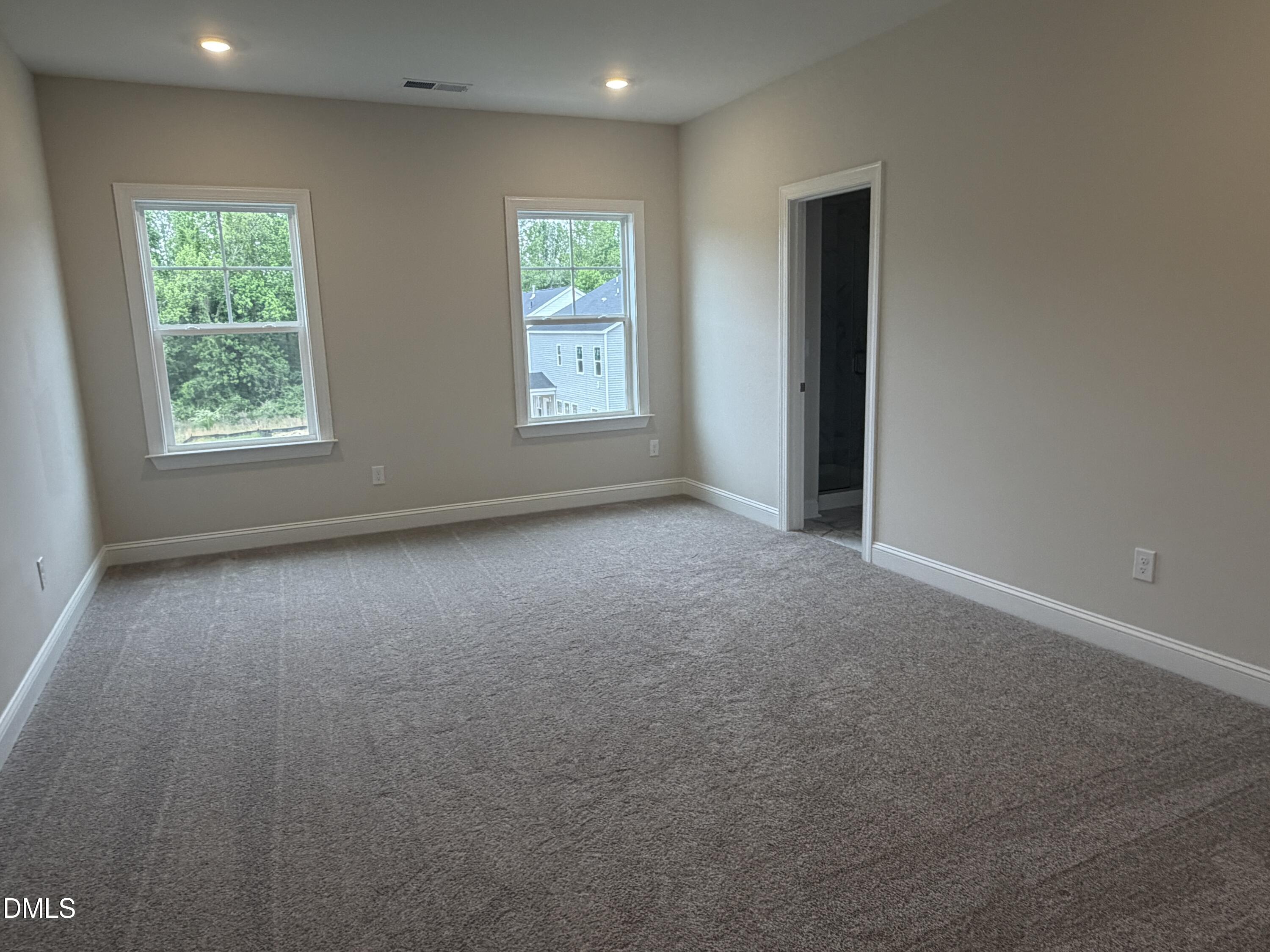 4210 Gray Alder Lane Raleigh, NC 27616 - Photo 13 of 31 an empty room with windows
