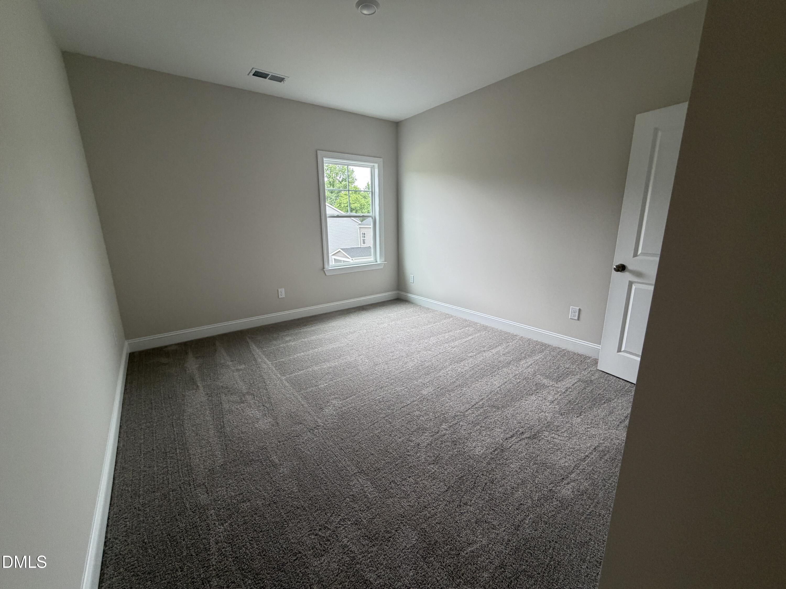 4210 Gray Alder Lane Raleigh, NC 27616 - Photo 14 of 31 an empty room with a window
