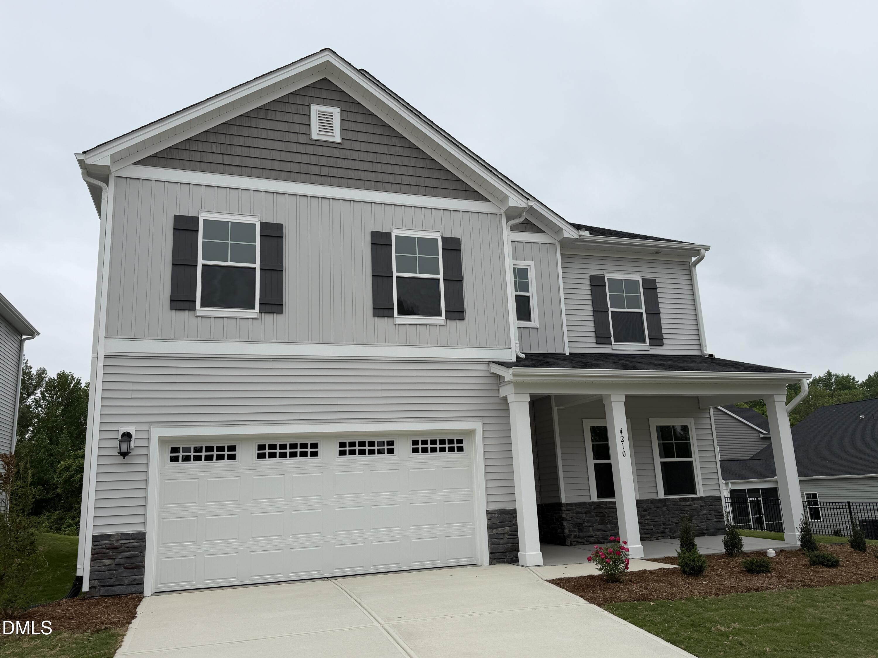 4210 Gray Alder Lane Raleigh, NC 27616 - Photo 2 of 31 a front view of a house with a yard