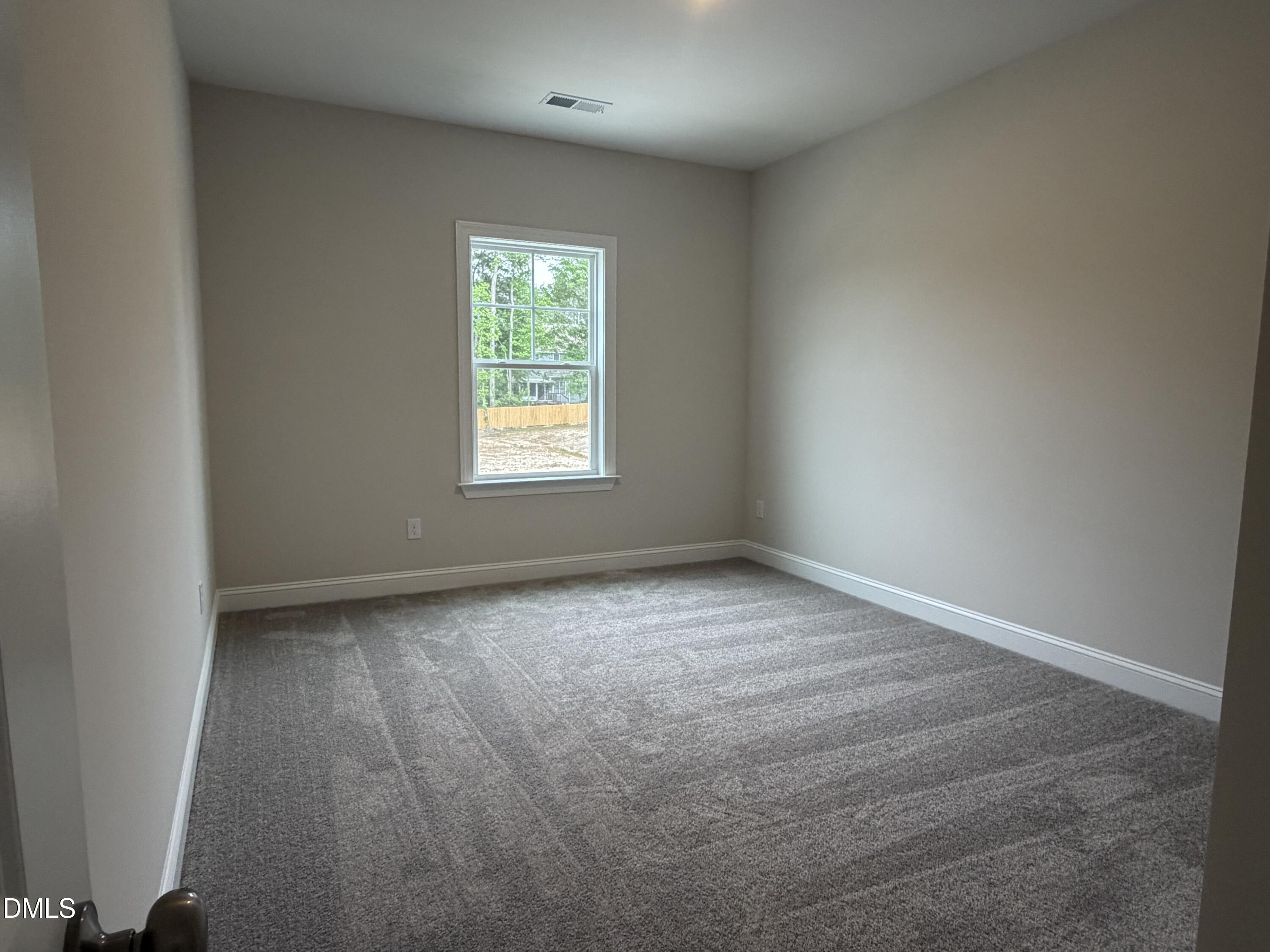 4210 Gray Alder Lane Raleigh, NC 27616 - Photo 21 of 31 an empty room with a window