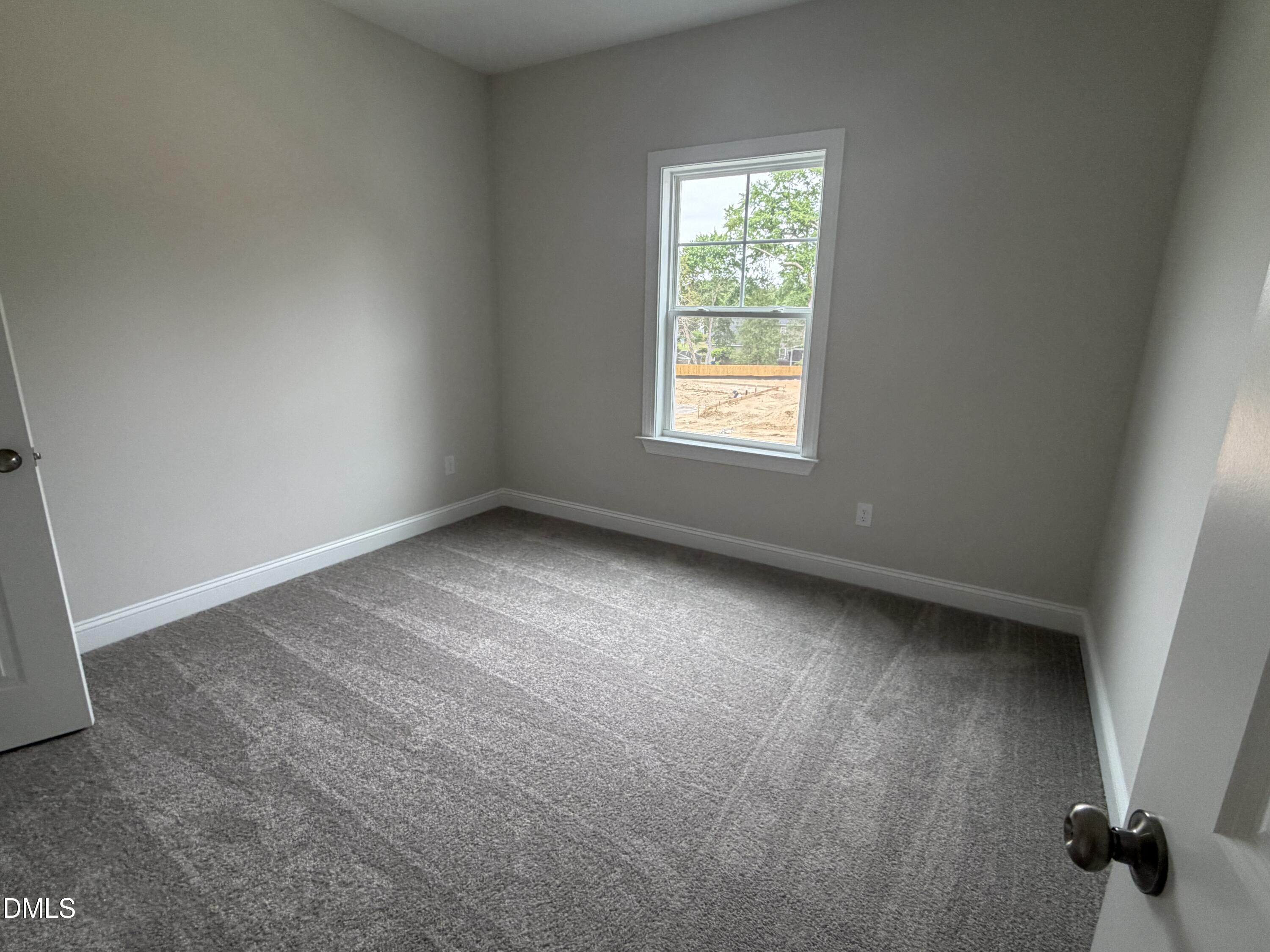 4210 Gray Alder Lane Raleigh, NC 27616 - Photo 25 of 31 an empty room with a window