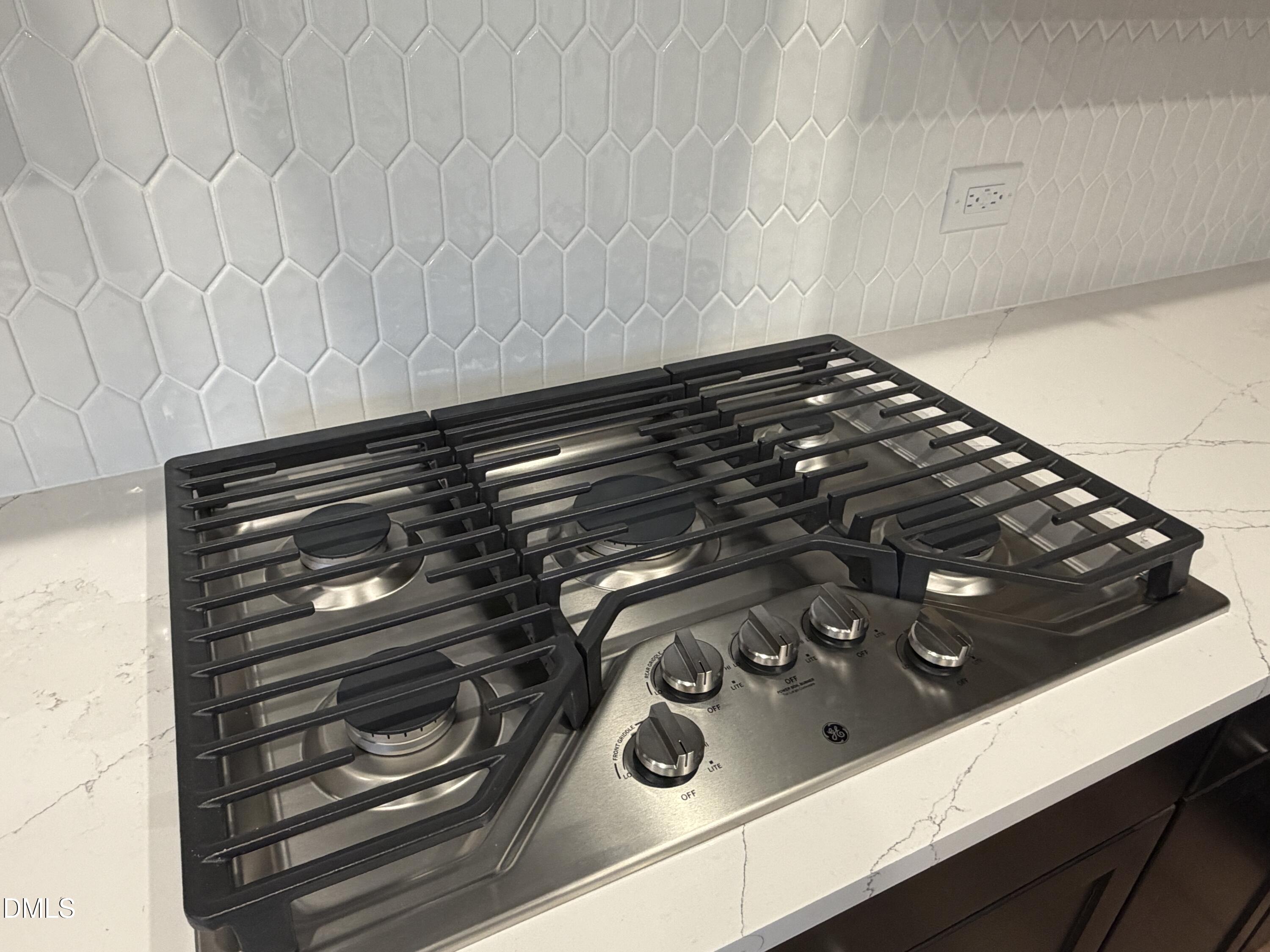 4210 Gray Alder Lane Raleigh, NC 27616 - Photo 5 of 31 a close up of a stove top oven