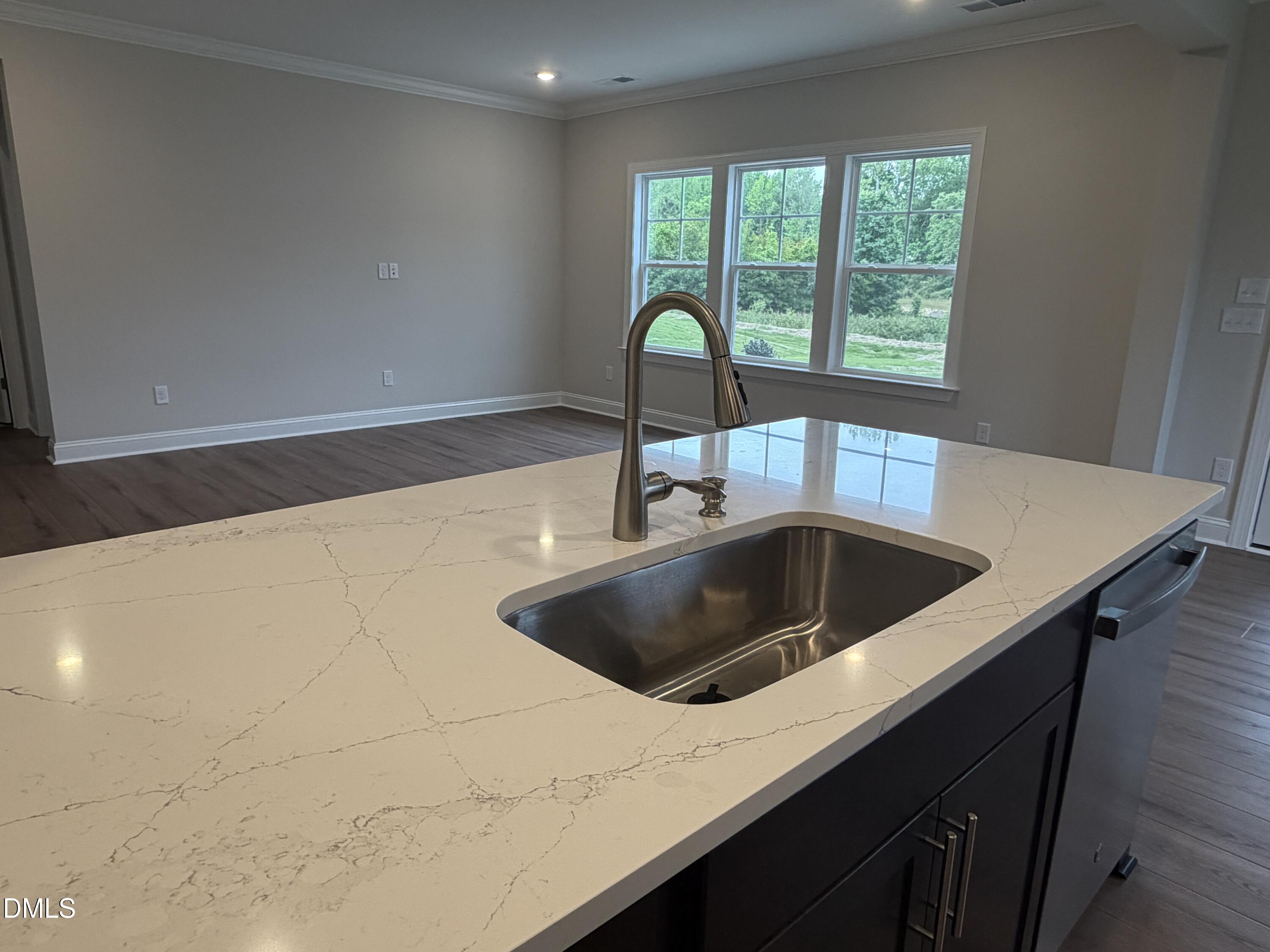 4210 Gray Alder Lane Raleigh, NC 27616 - Photo 7 of 31 a kitchen with a sink and a window