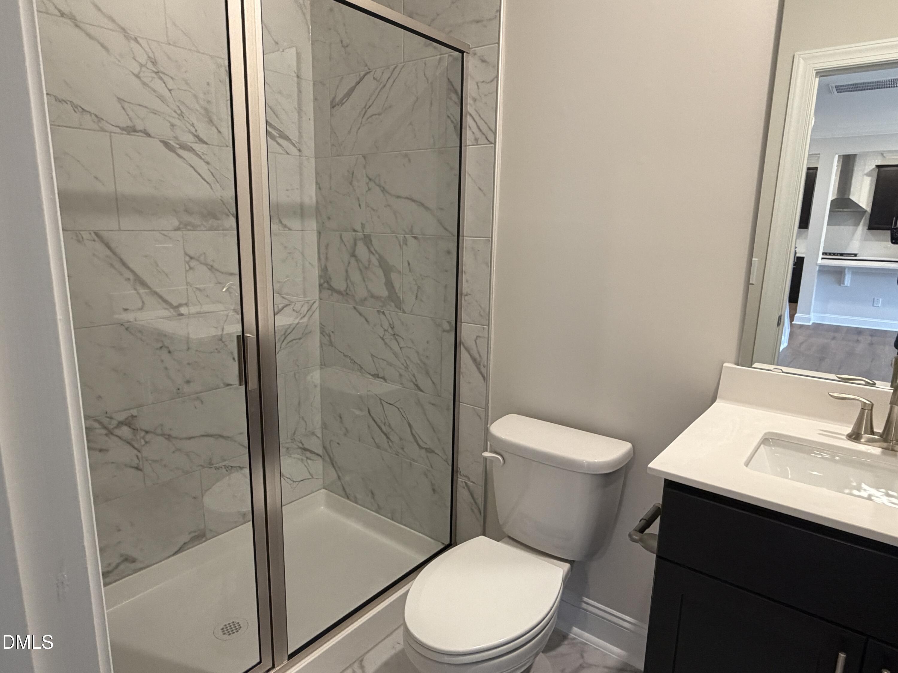 4210 Gray Alder Lane Raleigh, NC 27616 - Photo 10 of 31 a white toilet sitting next to a bathroom sink