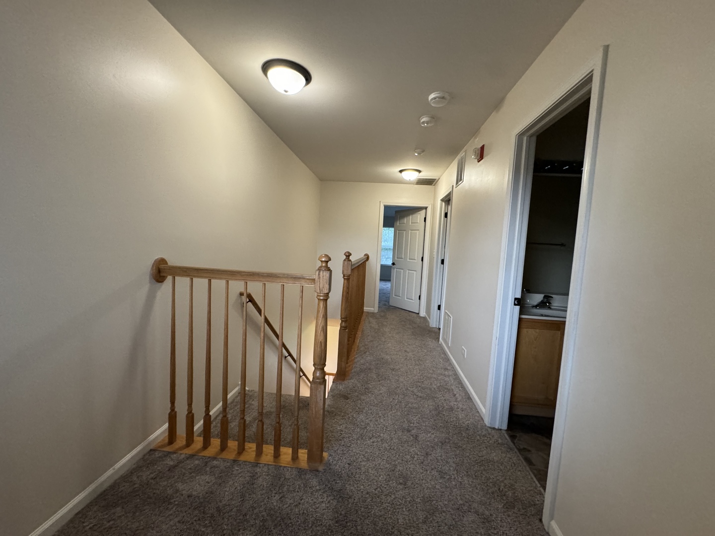 909 Genesee Drive Naperville, IL 60563 - Photo 19 of 26 a view of hallway with stairs