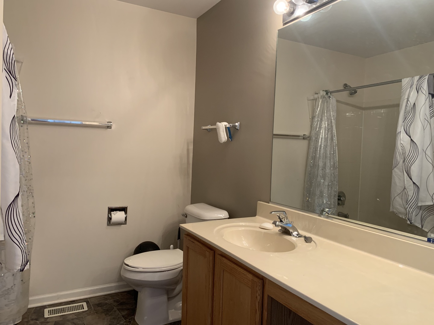 909 Genesee Drive Naperville, IL 60563 - Photo 20 of 26 a bathroom with a sink toilet and shower