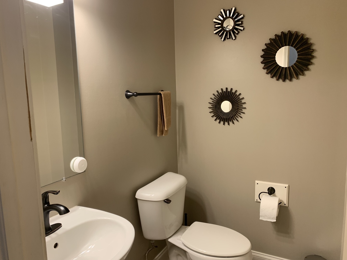 909 Genesee Drive Naperville, IL 60563 - Photo 23 of 26 a white toilet sitting next to a bathroom sink