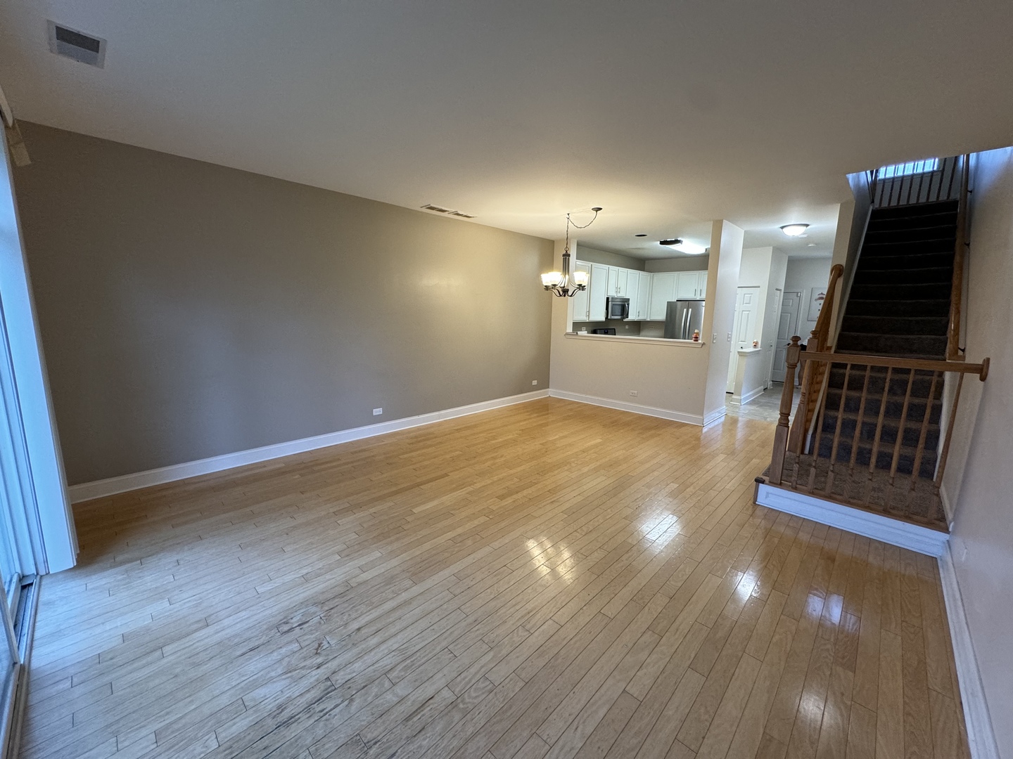909 Genesee Drive Naperville, IL 60563 - Photo 4 of 26 a view of a livingroom with wooden floor
