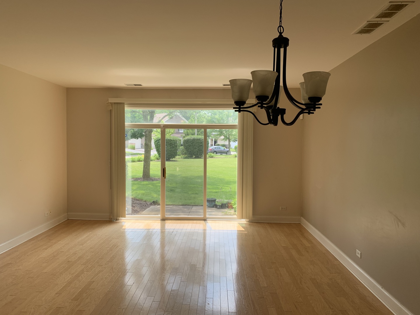 909 Genesee Drive Naperville, IL 60563 - Photo 5 of 26 a view of empty room with floor to ceiling window