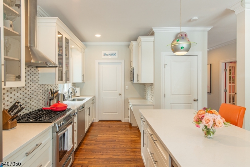 8 Madison Avenue Montclair, NJ 07042 - Photo 12 of 49 a kitchen with stainless steel appliances a stove a sink and a refrigerator
