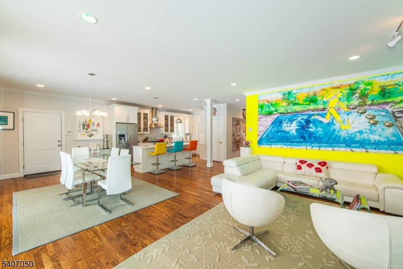 8 Madison Avenue Montclair, NJ 07042 - Photo 18 of 49 a living room with dining room and wooden floor