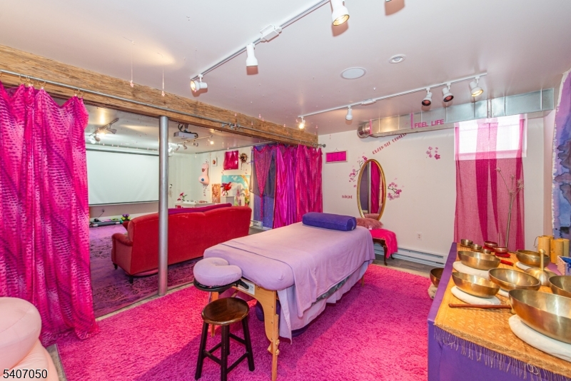 8 Madison Avenue Montclair, NJ 07042 - Photo 24 of 49 a bed room with a bed mirror and a window