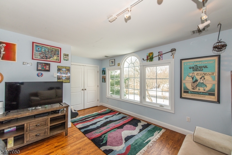 8 Madison Avenue Montclair, NJ 07042 - Photo 28 of 49 a living room with furniture and a flat screen tv