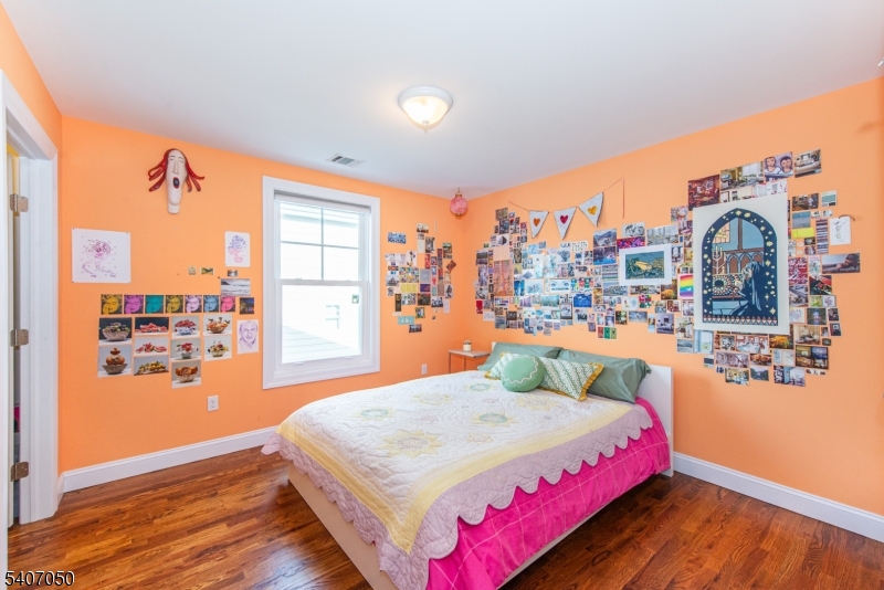8 Madison Avenue Montclair, NJ 07042 - Photo 29 of 49 a bedroom with a large bed and a large window