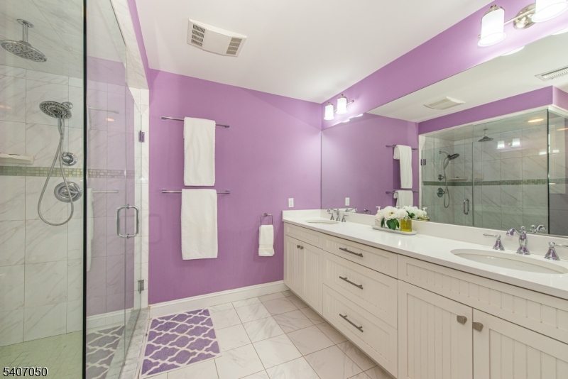 8 Madison Avenue Montclair, NJ 07042 - Photo 31 of 49 a spacious bathroom with a granite countertop shower sink and mirror