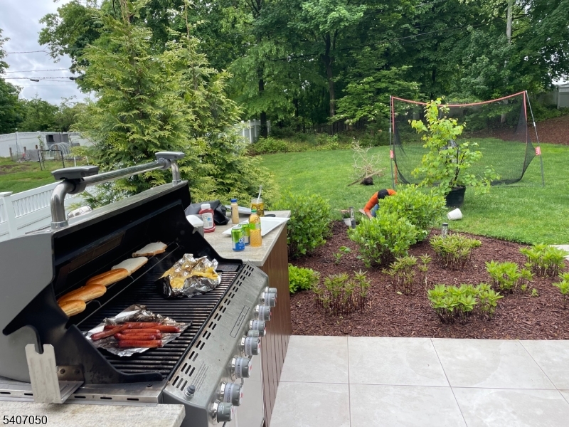 8 Madison Avenue Montclair, NJ 07042 - Photo 44 of 49 a backyard of a house with lots of green space