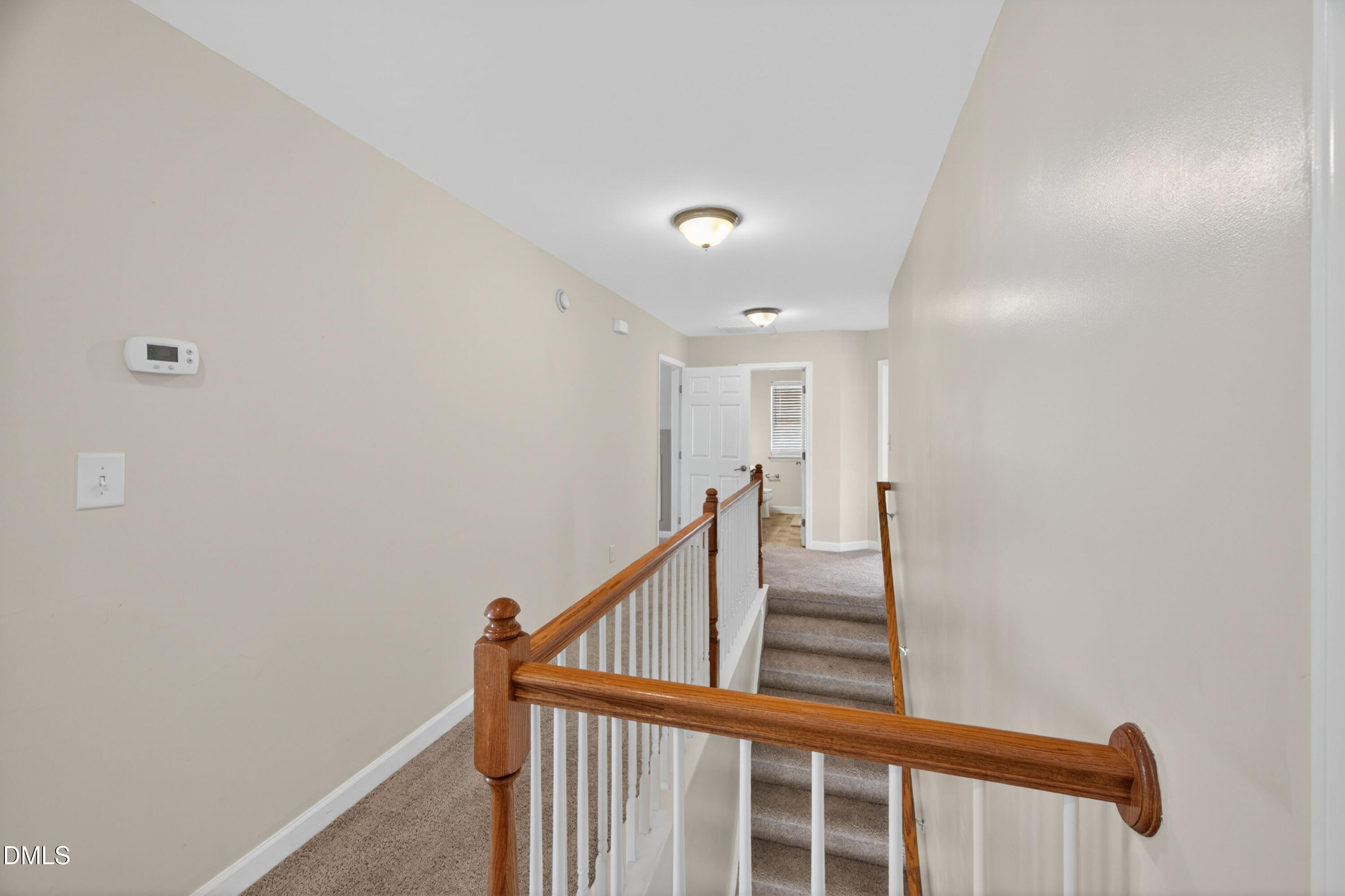 5304 Stone Station Drive Raleigh, NC 27616 - Photo 13 of 34 a view of a hallway with staircase
