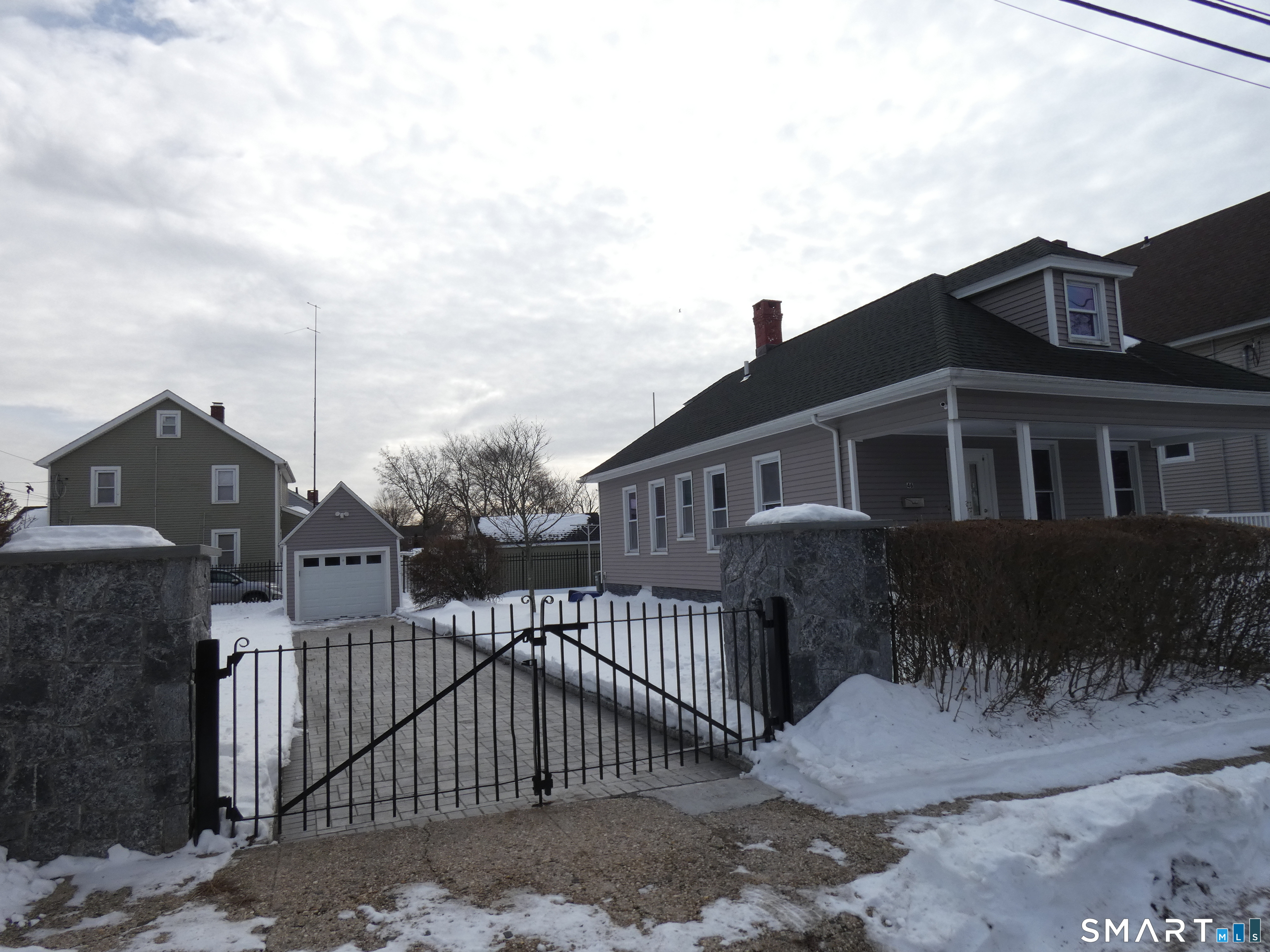 46 York Street Bridgeport, CT 06610 - Photo 3 of 21 a front view of a house with a garden