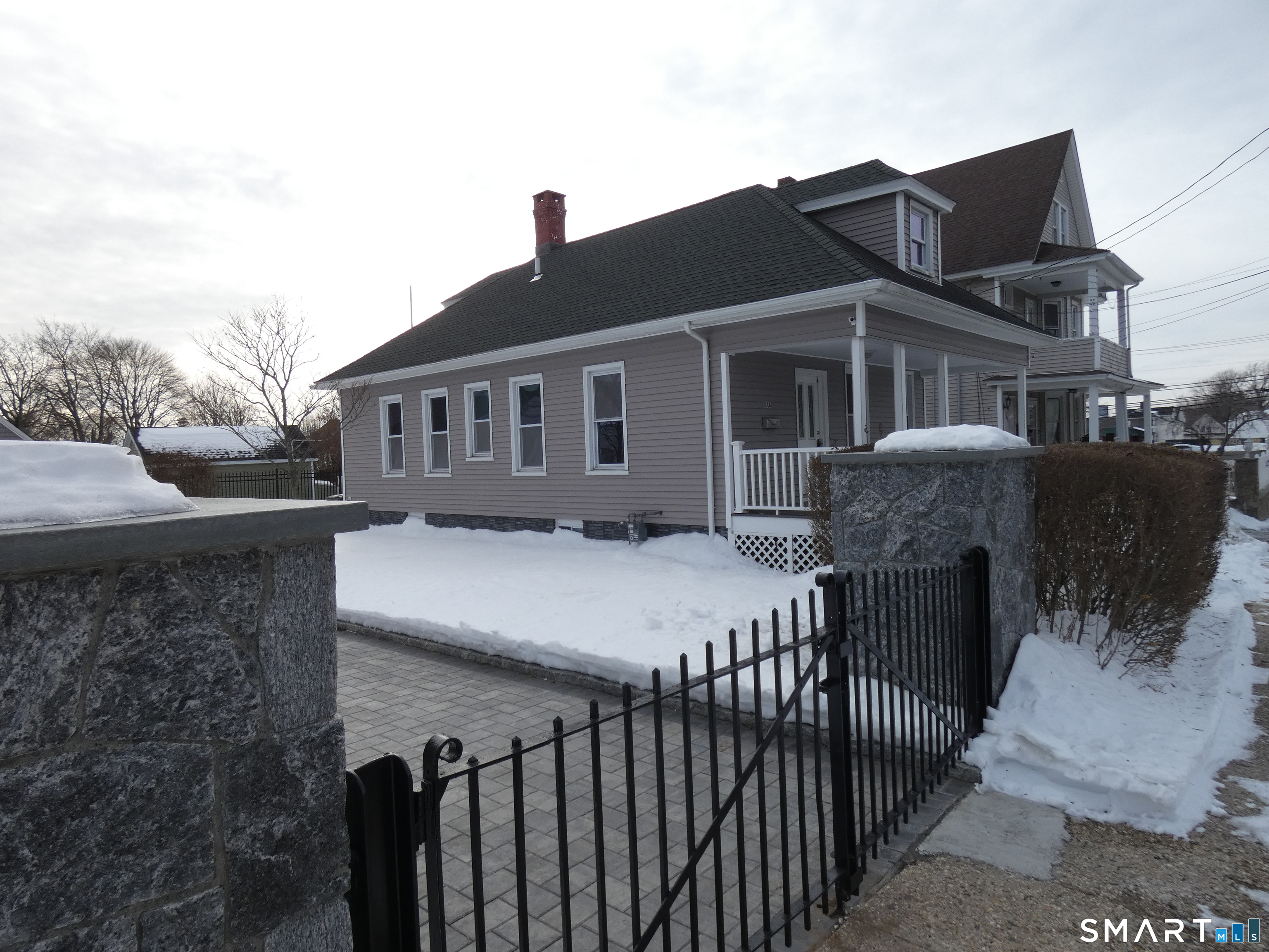 46 York Street Bridgeport, CT 06610 - Photo 4 of 21 a front view of a house with yard