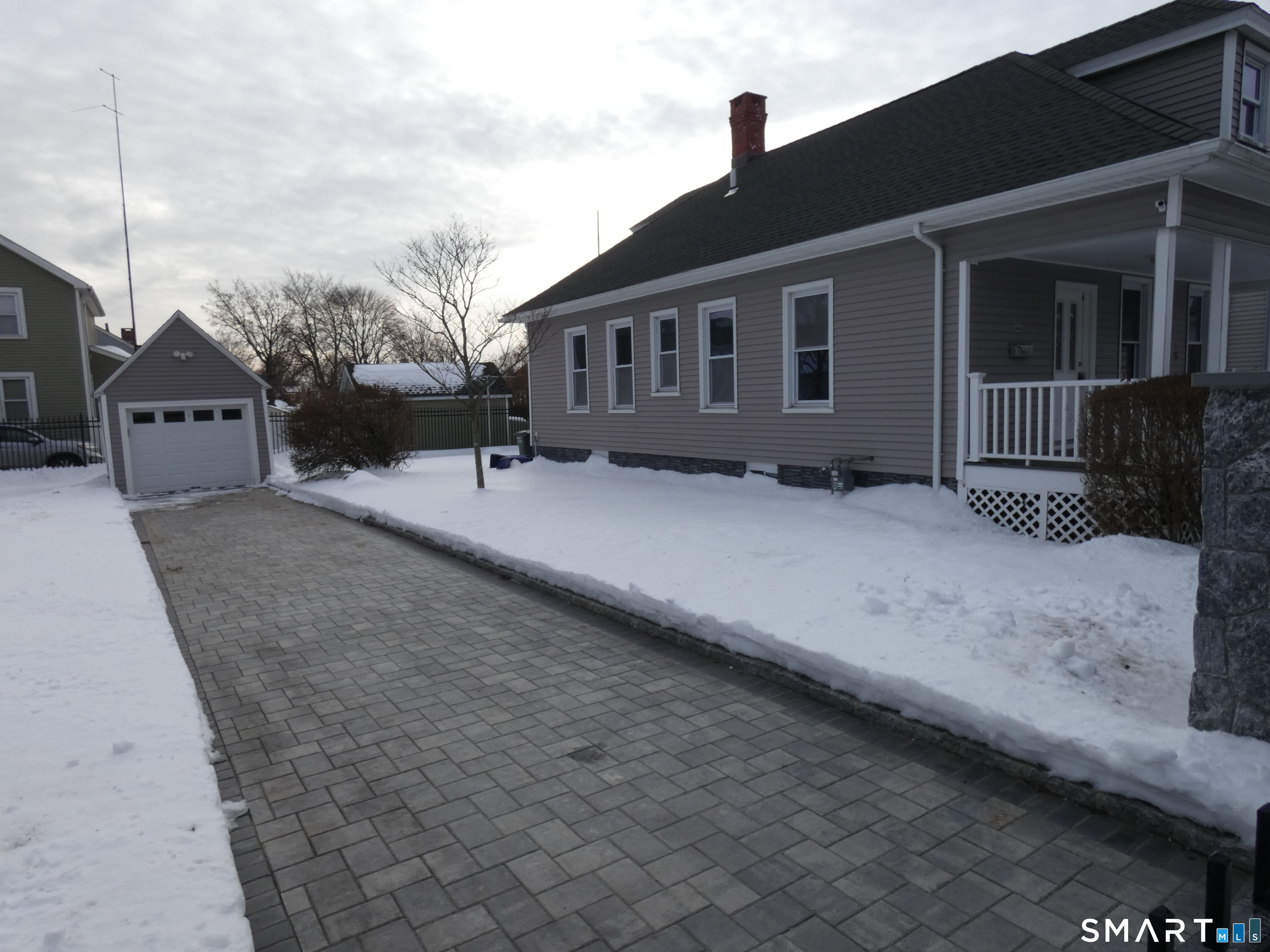 46 York Street Bridgeport, CT 06610 - Photo 5 of 21 a backyard of a house with large trees and barbeque oven