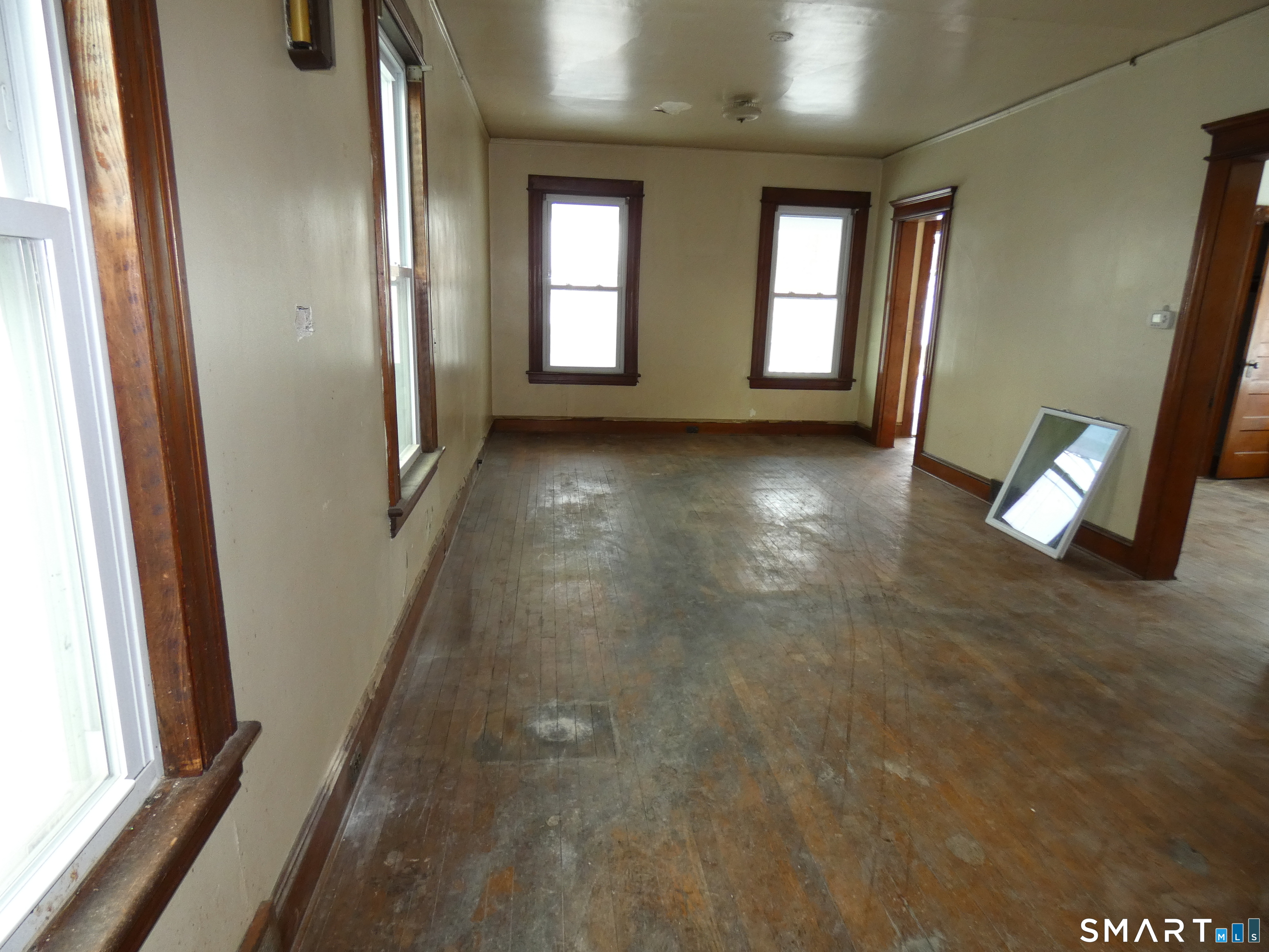 46 York Street Bridgeport, CT 06610 - Photo 7 of 21 wooden floor in an empty room with a window