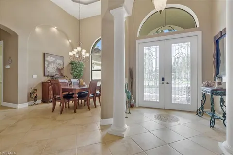 a view of a livingroom with furniture and a large window