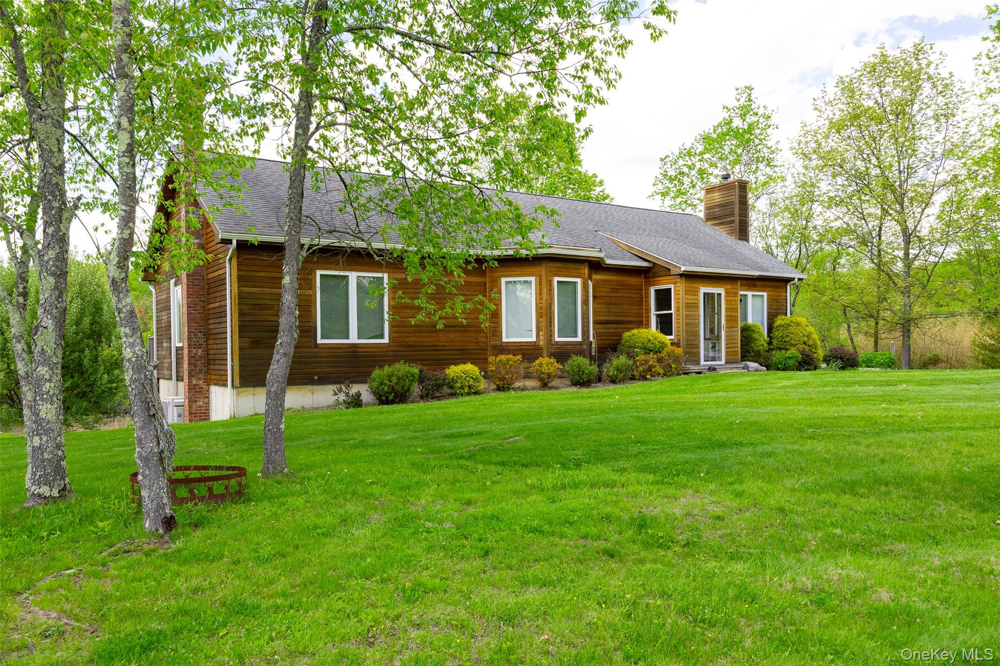 508 Woodstock Road Millbrook, NY 12545 - Photo 32 of 46 a front view of a house with a garden