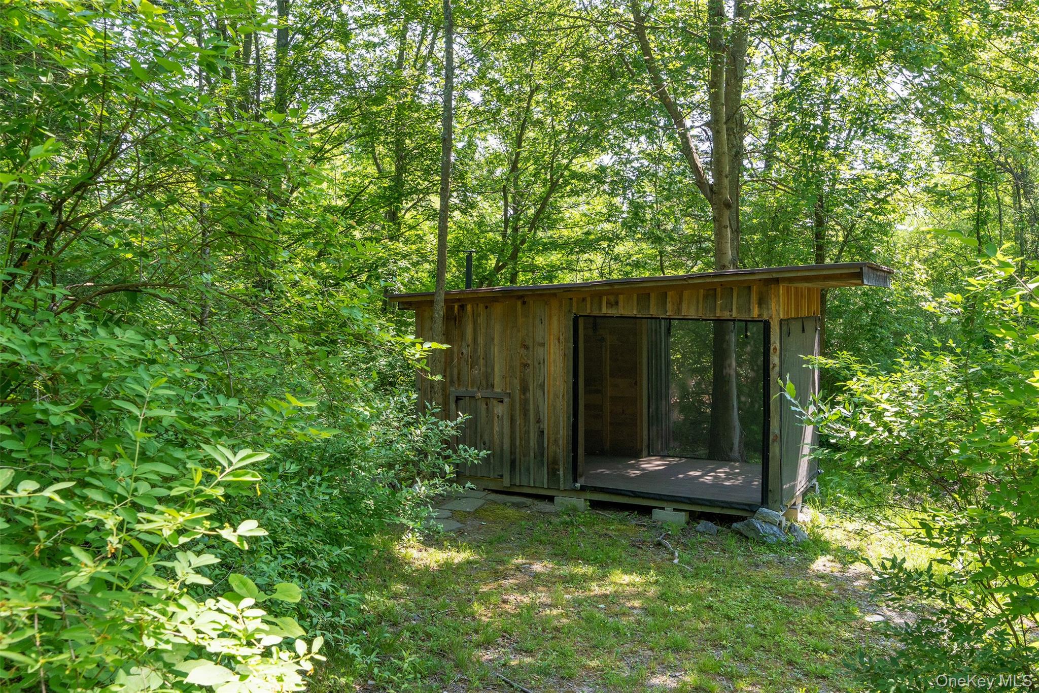 508 Woodstock Road Millbrook, NY 12545 - Photo 37 of 46 a view of house with backyard and garden